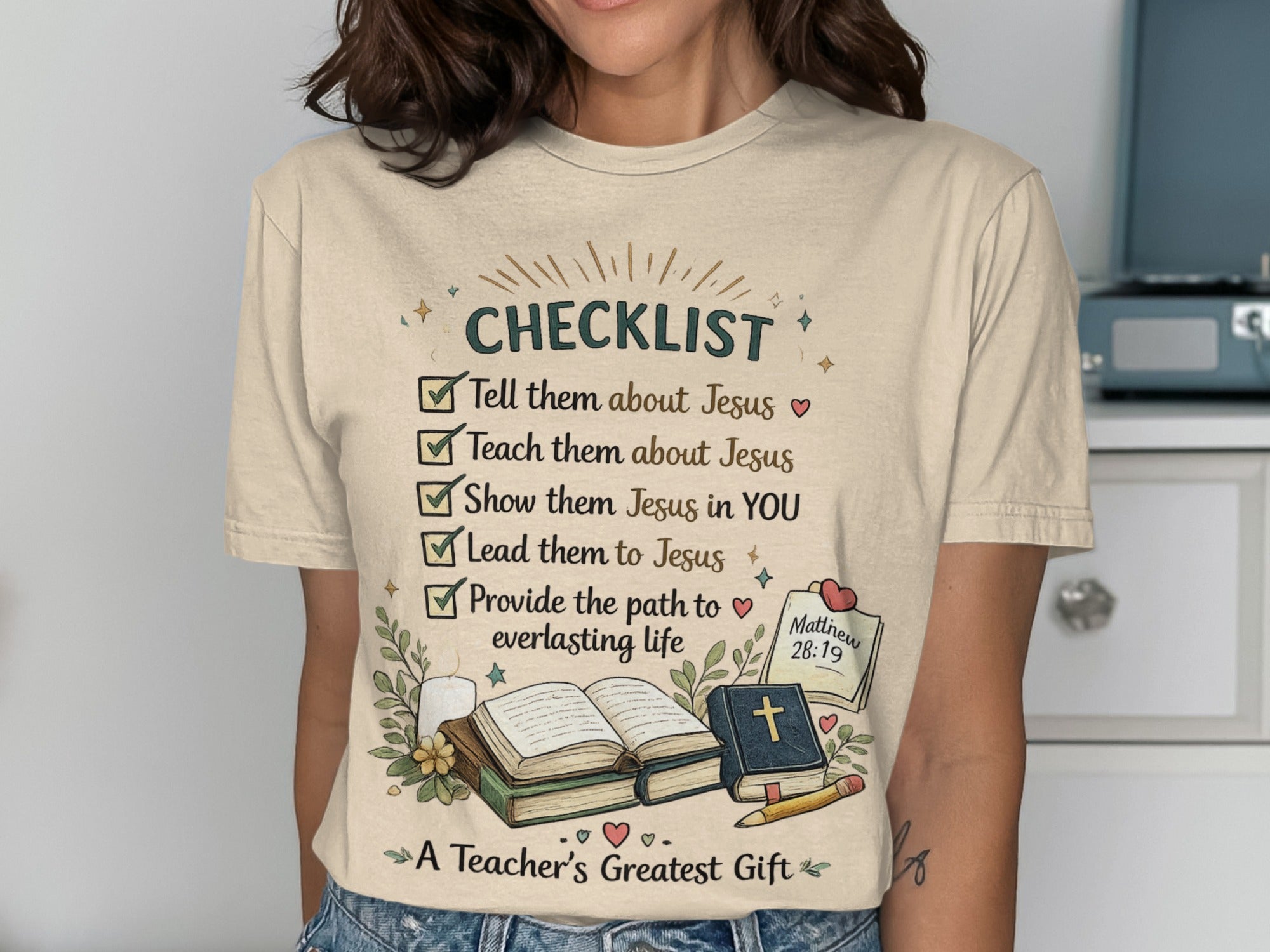 T-shirt with "CHECKLIST" and faith-based tasks, "A Teacher's Greatest Gift."