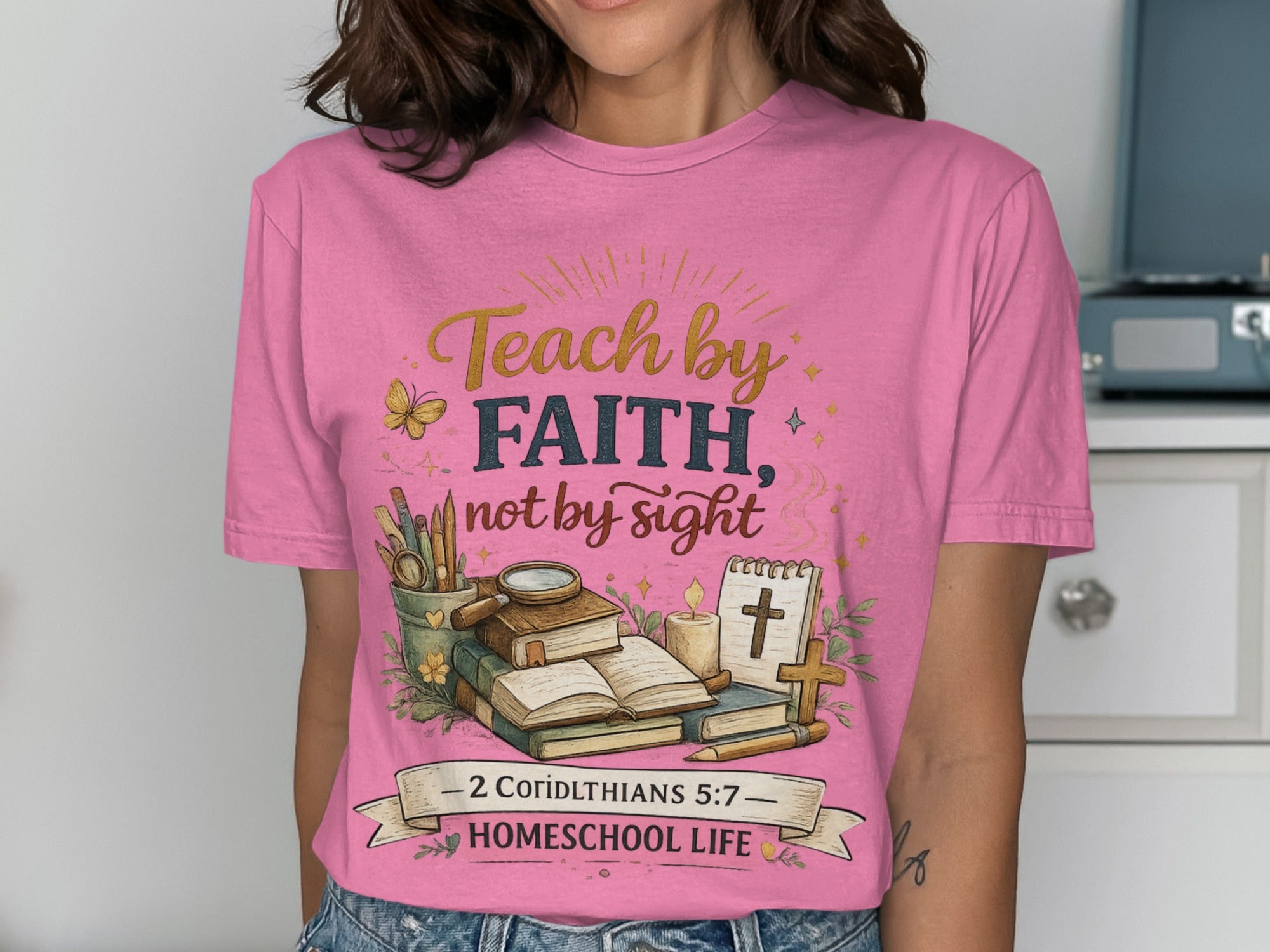 Pink t-shirt with "Teach by Faith, not by Sight" and homeschool theme.