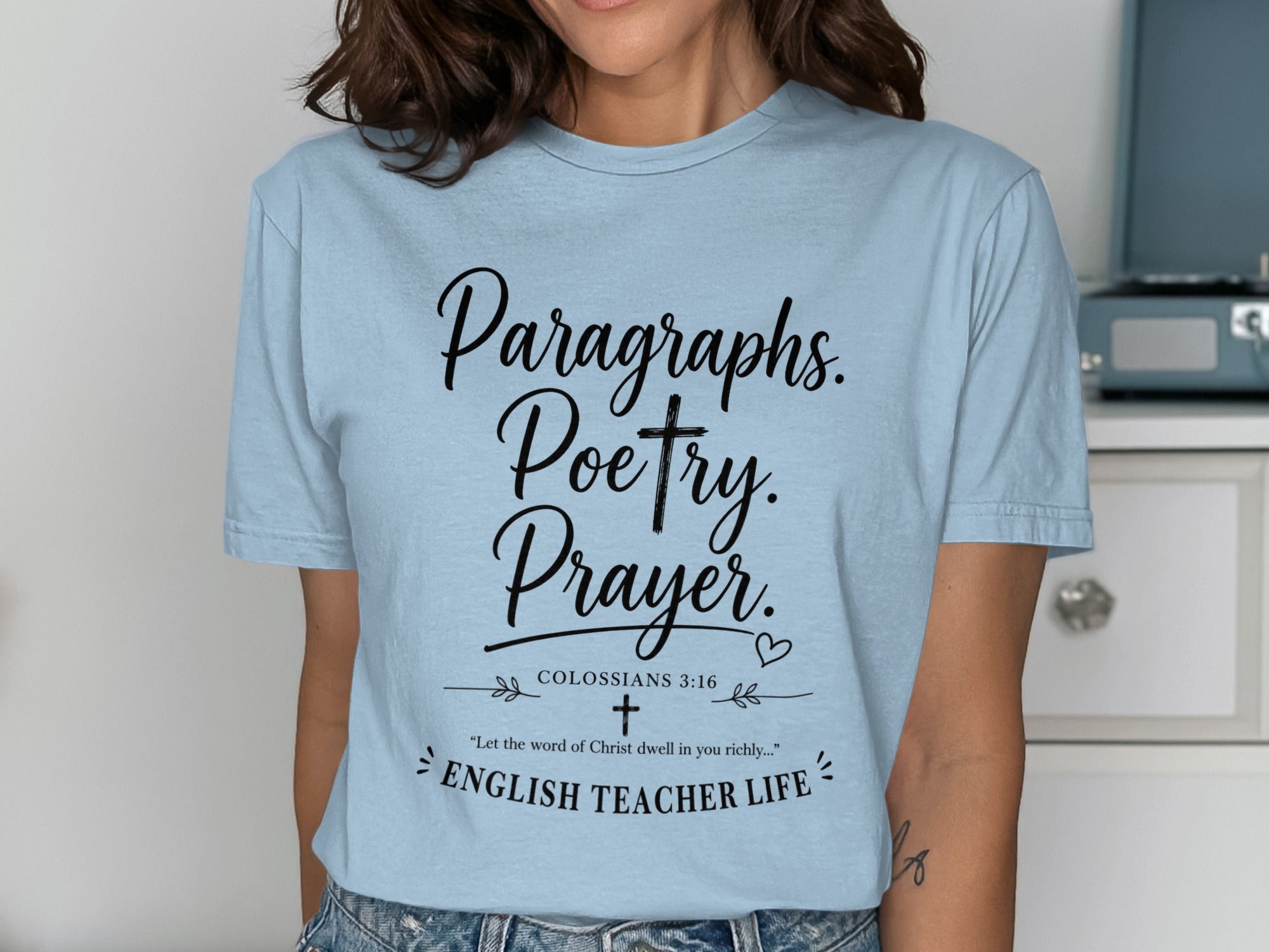 Light blue t-shirt with "Paragraphs. Poetry. Prayer." and Bible verse.