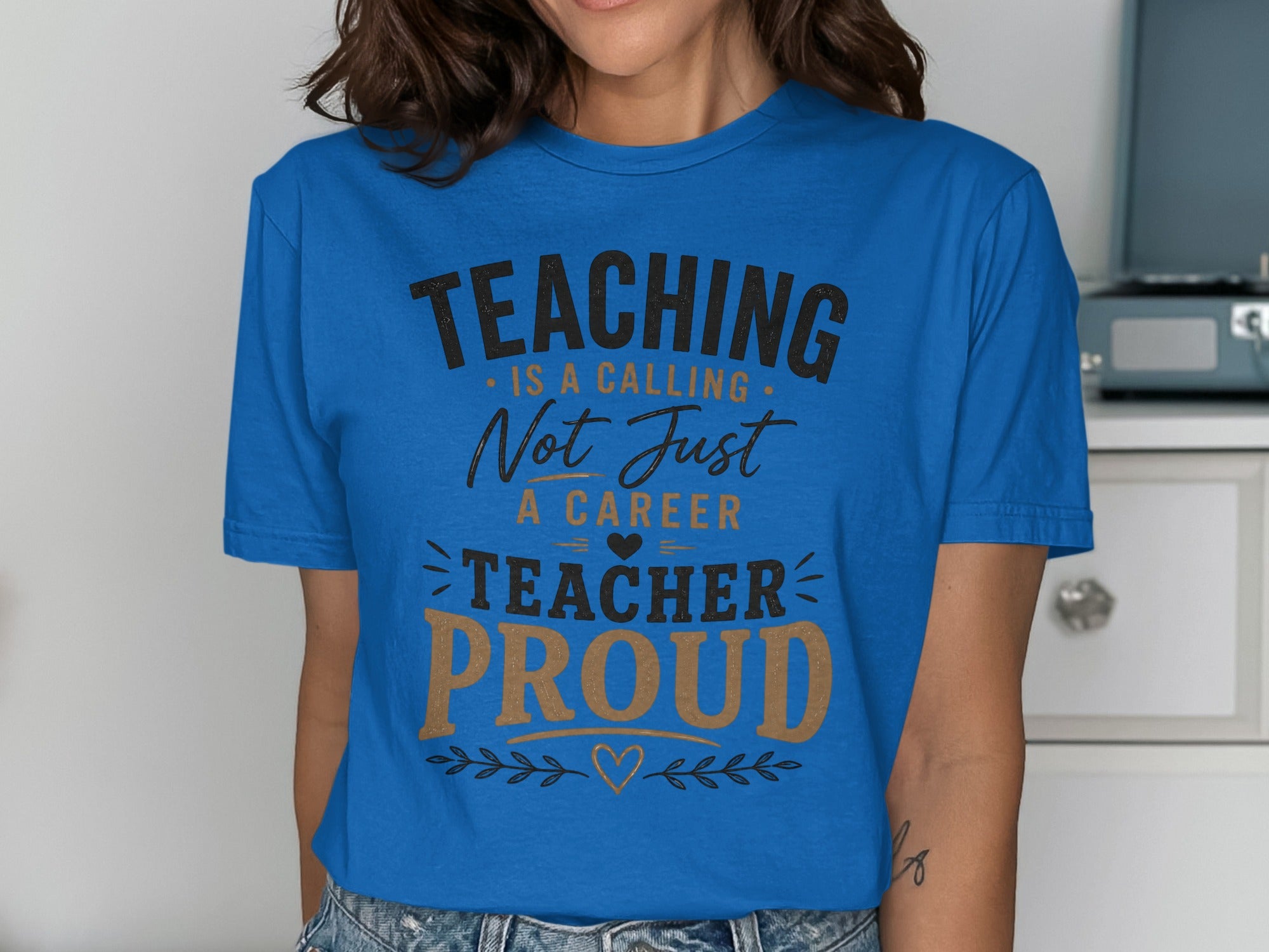 Blue t-shirt with "Teaching is a calling, not just a career. Teacher Proud" text.