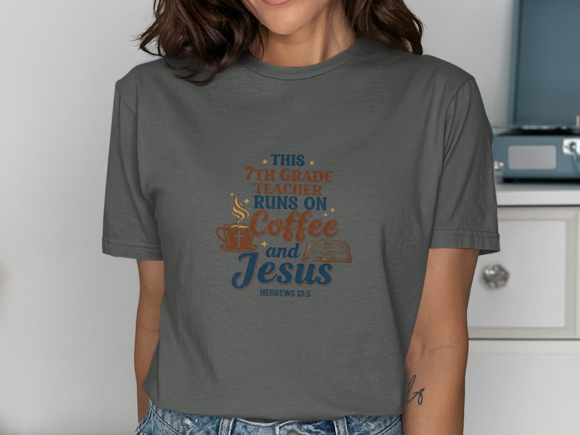 Dark grey t-shirt with "This 7th grade teacher runs on coffee and Jesus" and Bible verse.