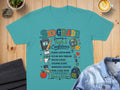 Teal t-shirt with "2nd Grade Growing in Faith & Confidence" and school subjects.
