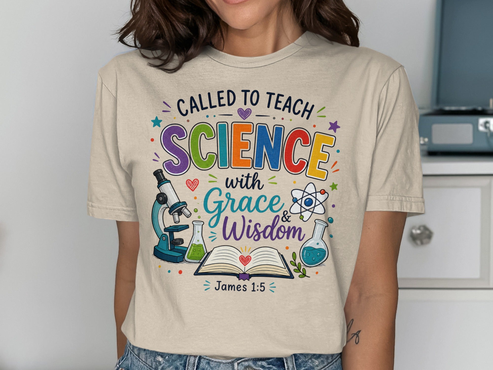T-shirt with "Called to Teach Science with Grace & Wisdom James 1:5" and science icons.