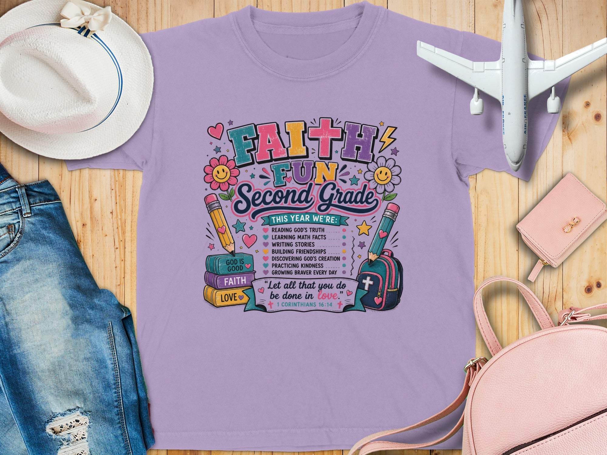 Lilac t-shirt with "Faith & Fun Second Grade" text, school supplies, and Bible verse.