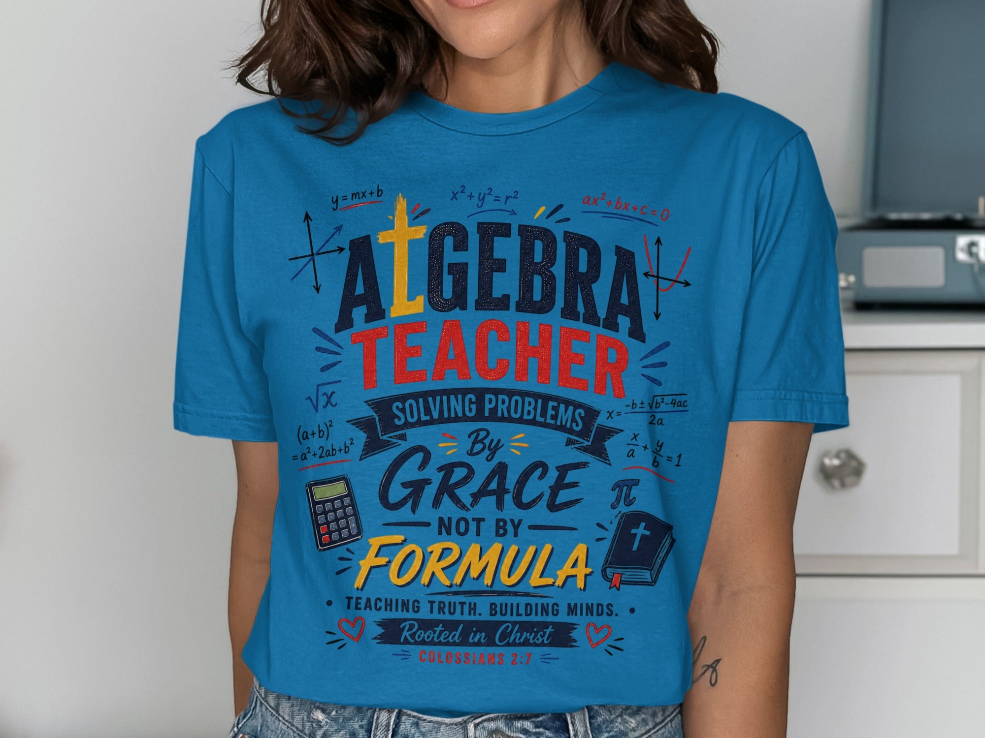 Blue t-shirt with "Algebra Teacher" and math equations.