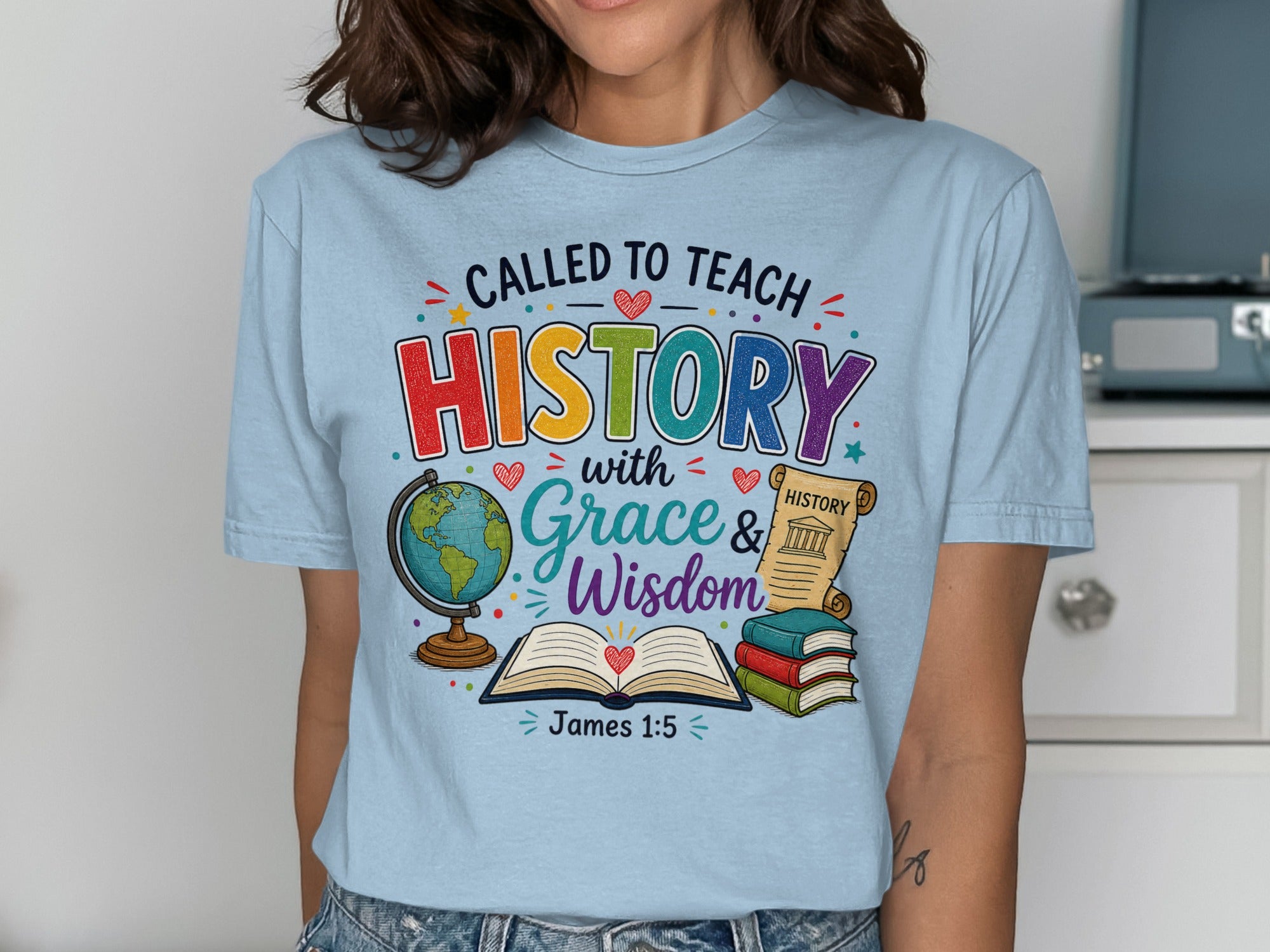 Light blue t-shirt with "Called to Teach History with Grace & Wisdom" and James 1:5.