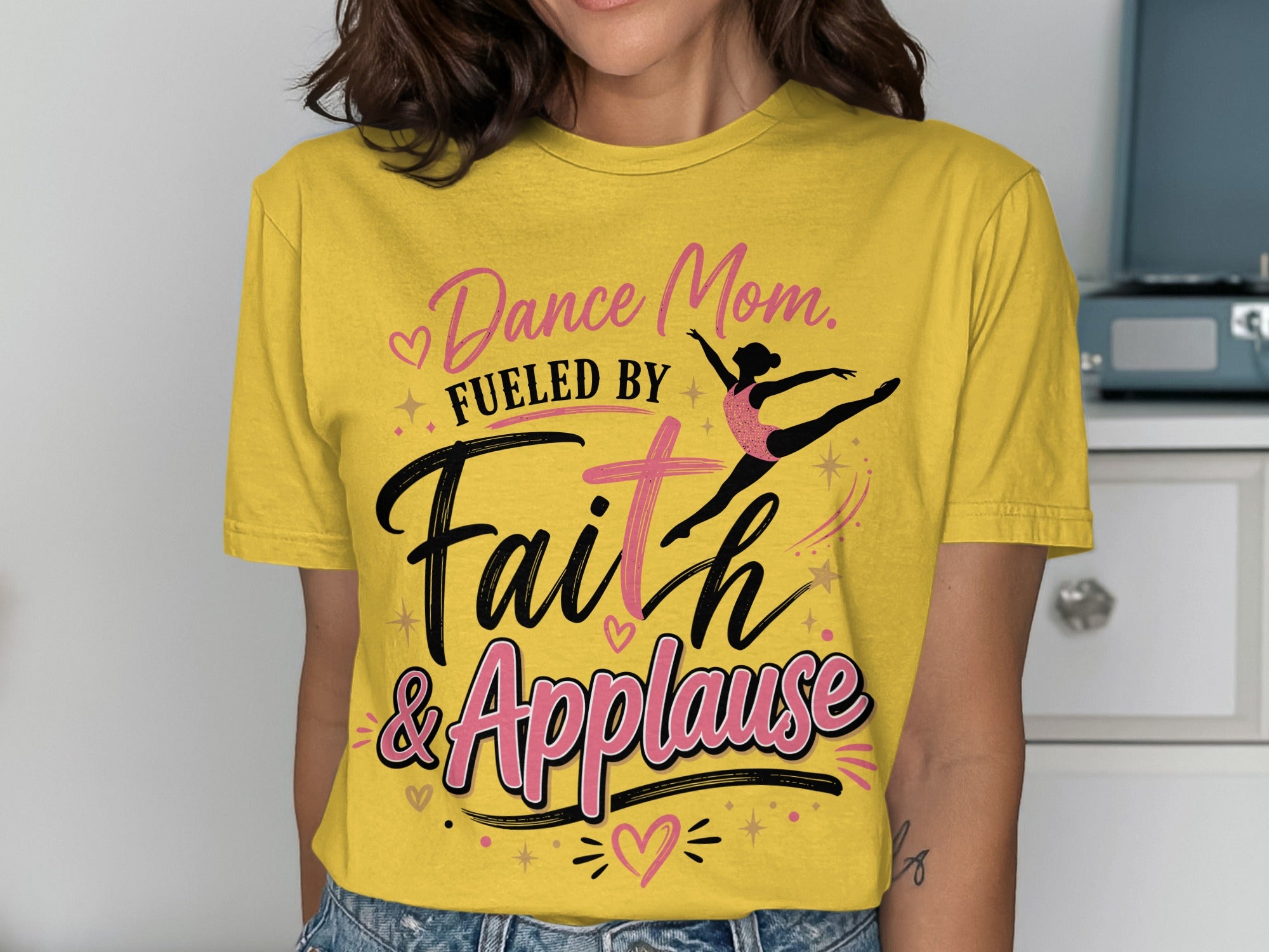 Yellow t-shirt with "Dance Mom. Fueled by Faith & Applause" and ballerina graphic.