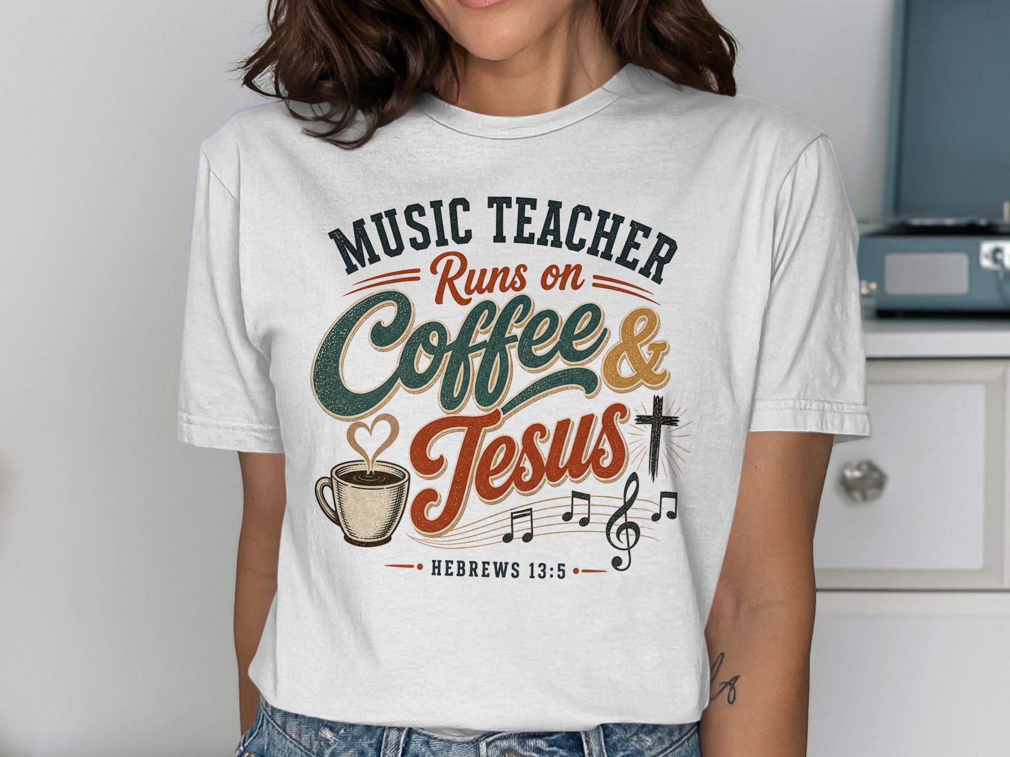 White t-shirt with "Music Teacher Runs on Coffee & Jesus" graphic and Hebrews 13:5.