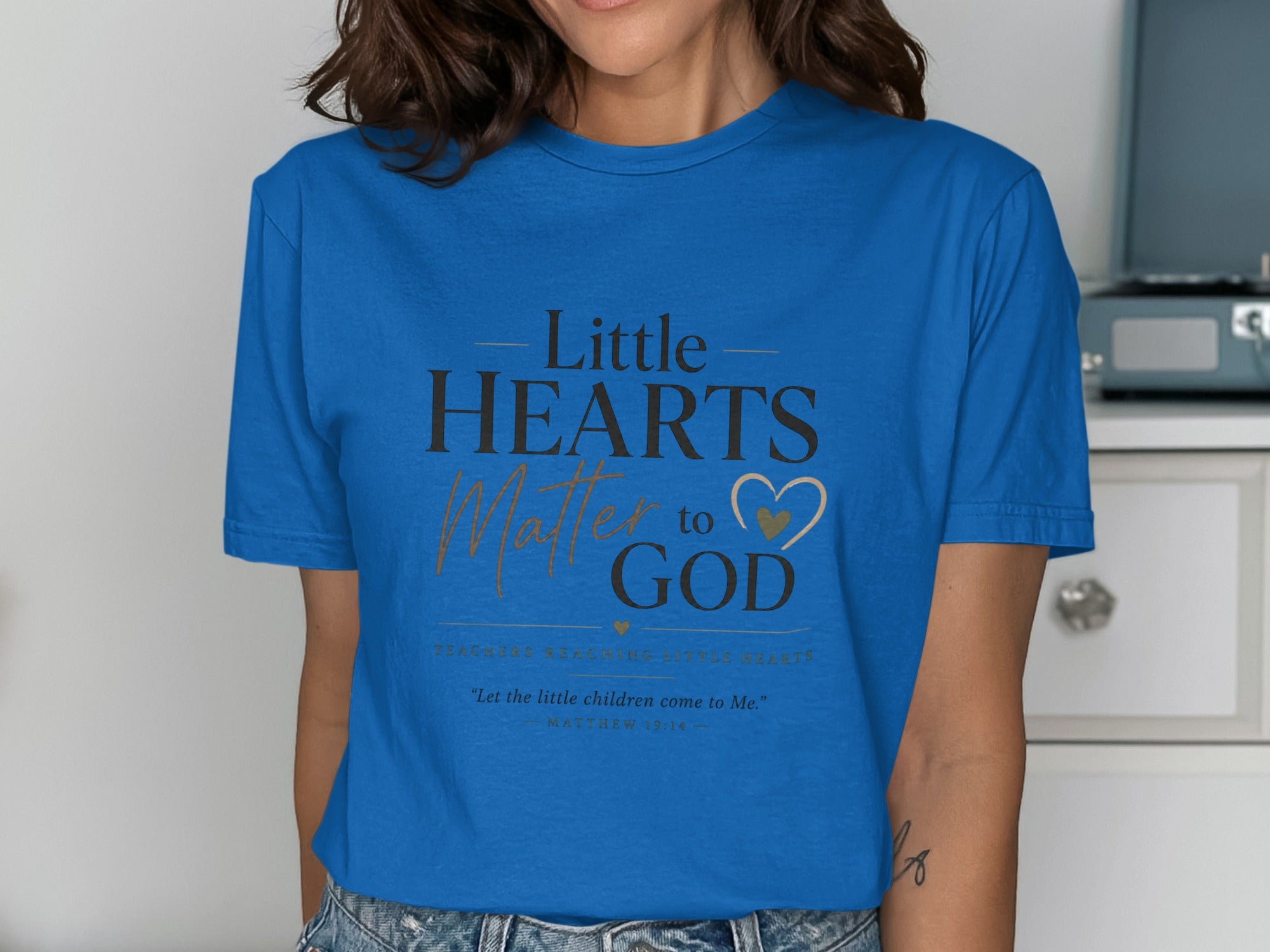 Blue t-shirt with "Little Hearts Matter to God" and Bible verse.
