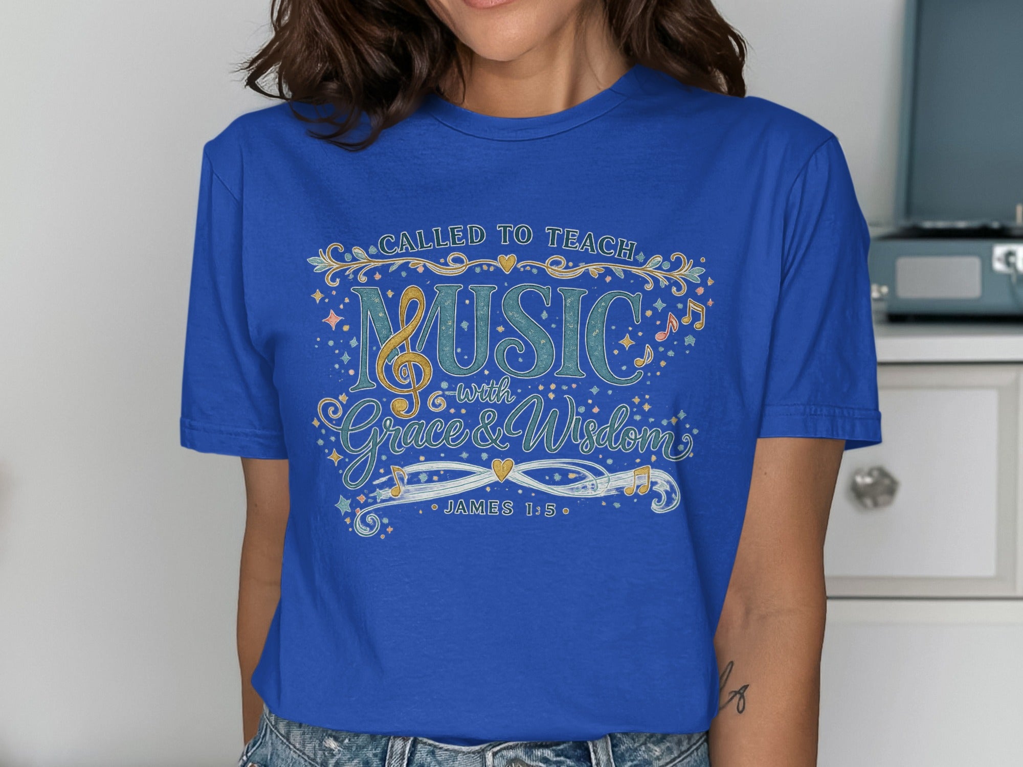 Blue t-shirt with "Called to Teach Music with Grace & Wisdom" and "James 1:5".