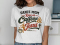 Dance mom runs on caffeine and Jesus, Hebrews 13:5, with coffee cup and cross.
