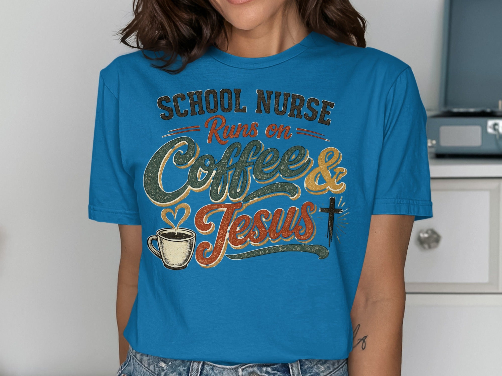 Blue t-shirt with "School Nurse Runs on Coffee & Jesus" text and graphics.