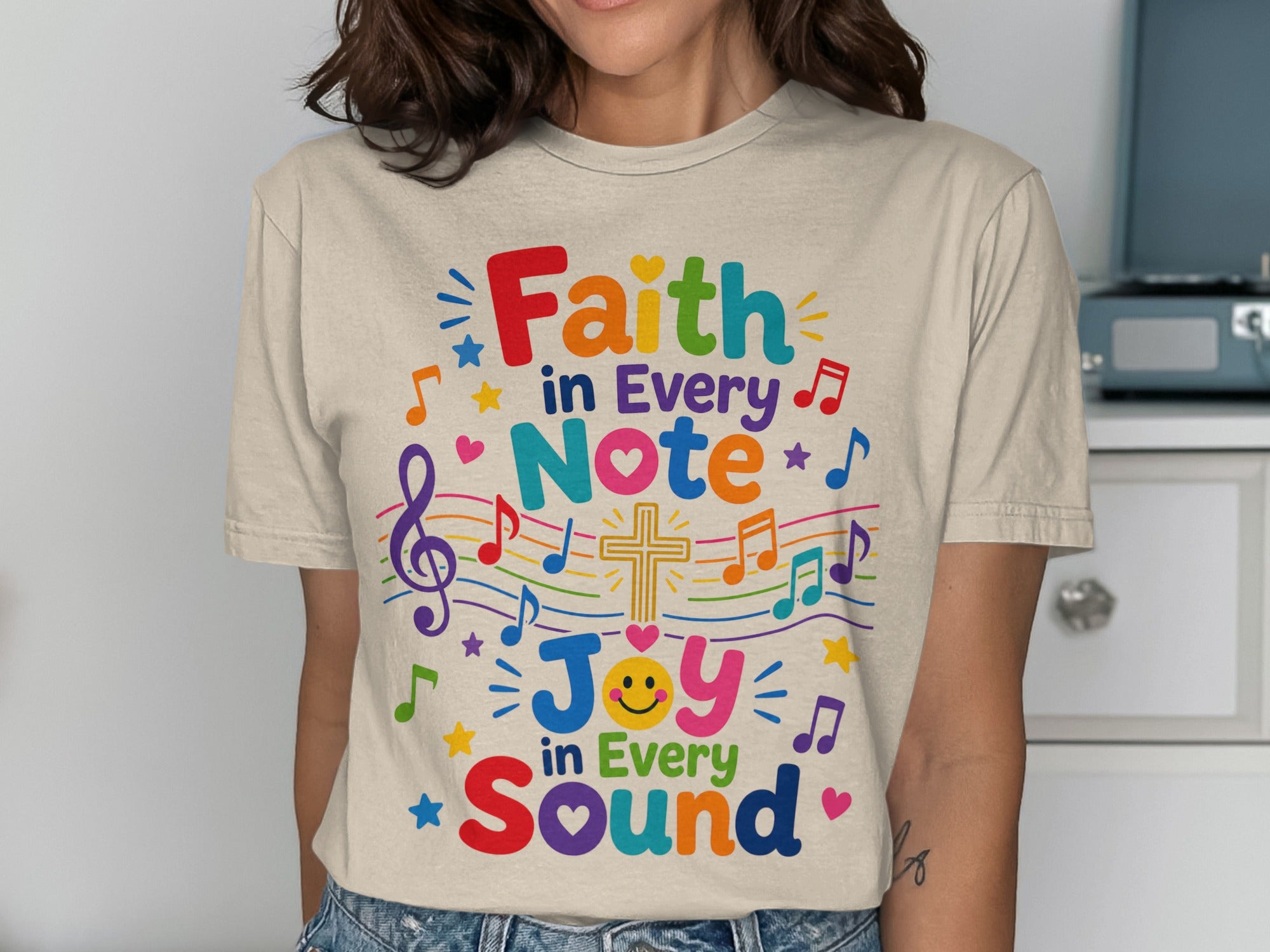 T-shirt with "Faith in Every Note, Joy in Every Sound" text and musical notes.