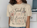 Cream t-shirt with "Seed Planted. Lives Changed. 1 Corinthians 3:6" and floral accents.