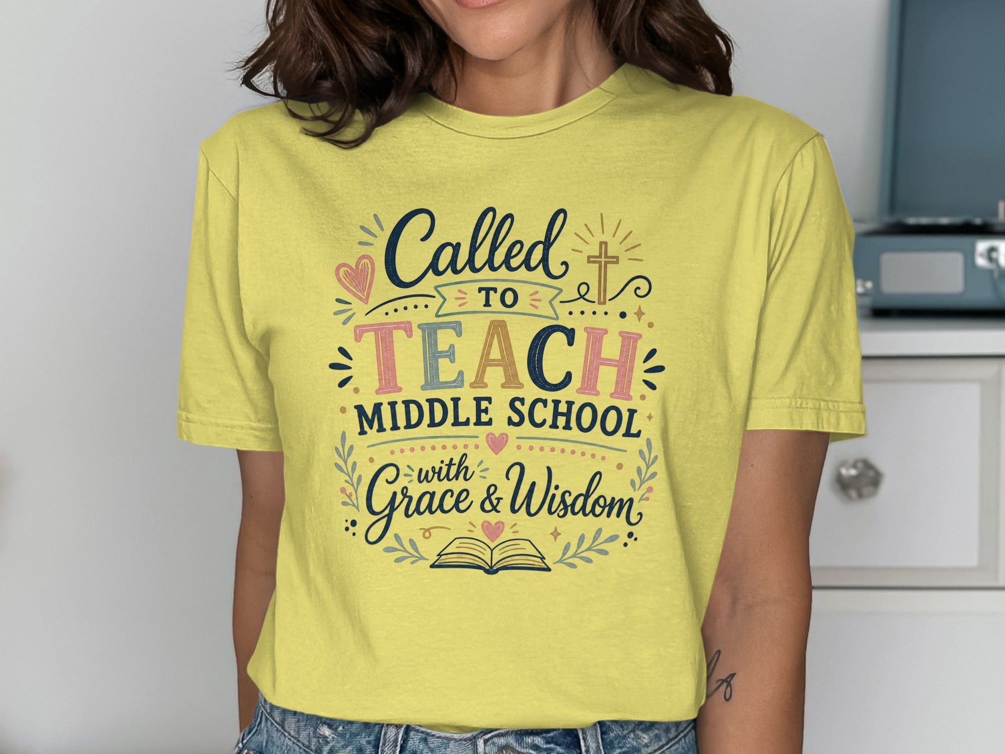 Yellow t-shirt with "Called to Teach Middle School with Grace & Wisdom" design.
