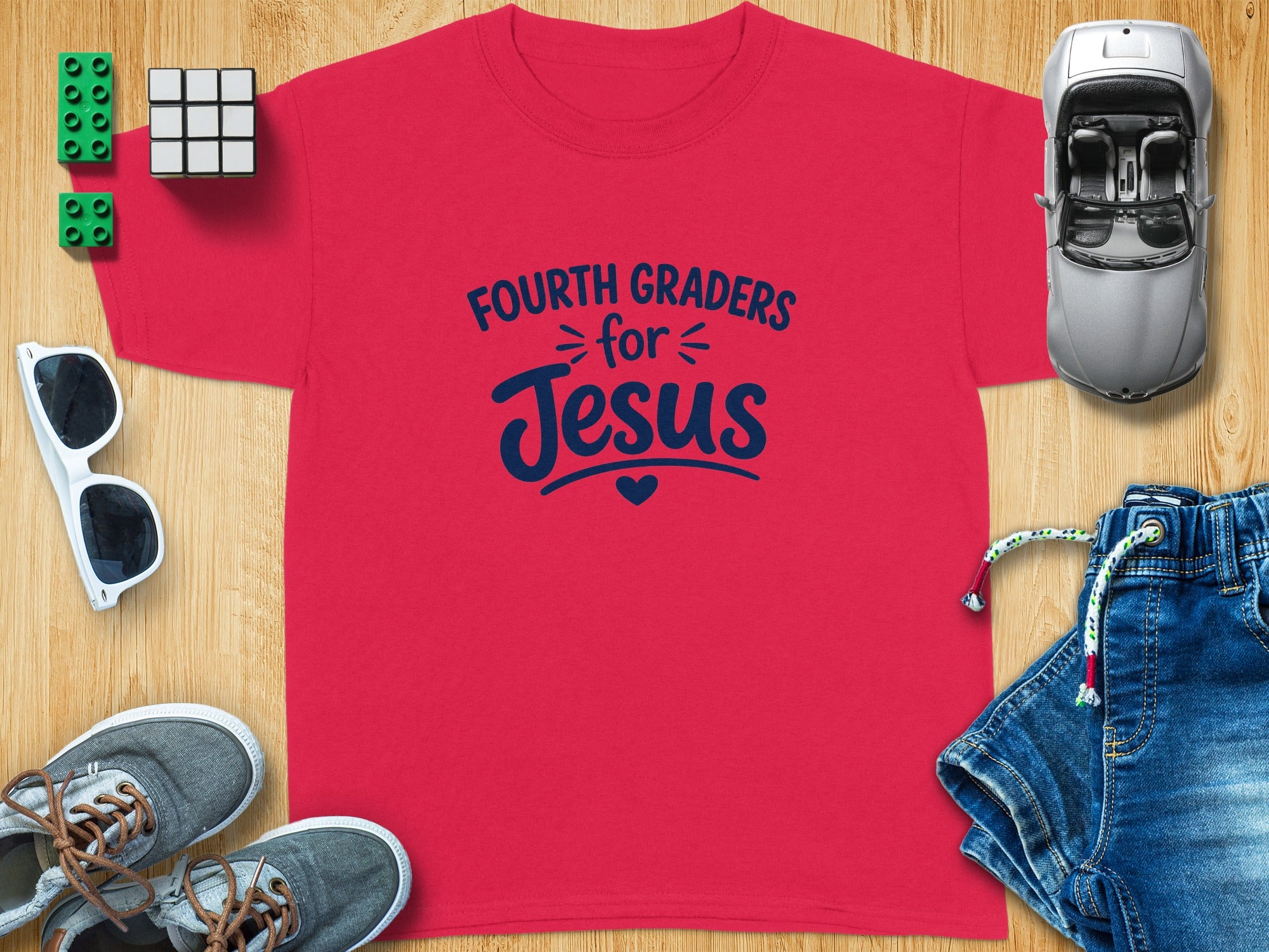 Red t-shirt with "Fourth Graders for Jesus" text and heart graphic.