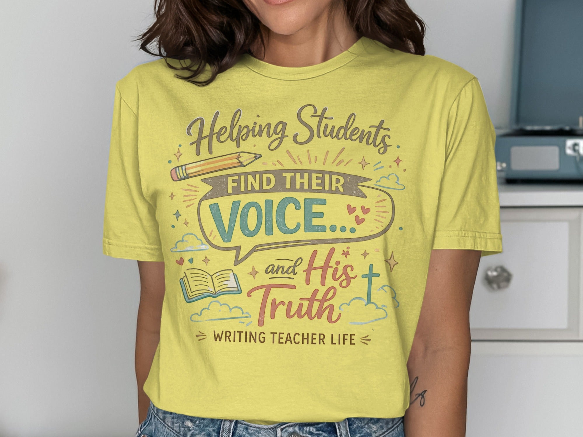 Yellow t-shirt with "Helping Students Find Their Voice and His Truth" text.