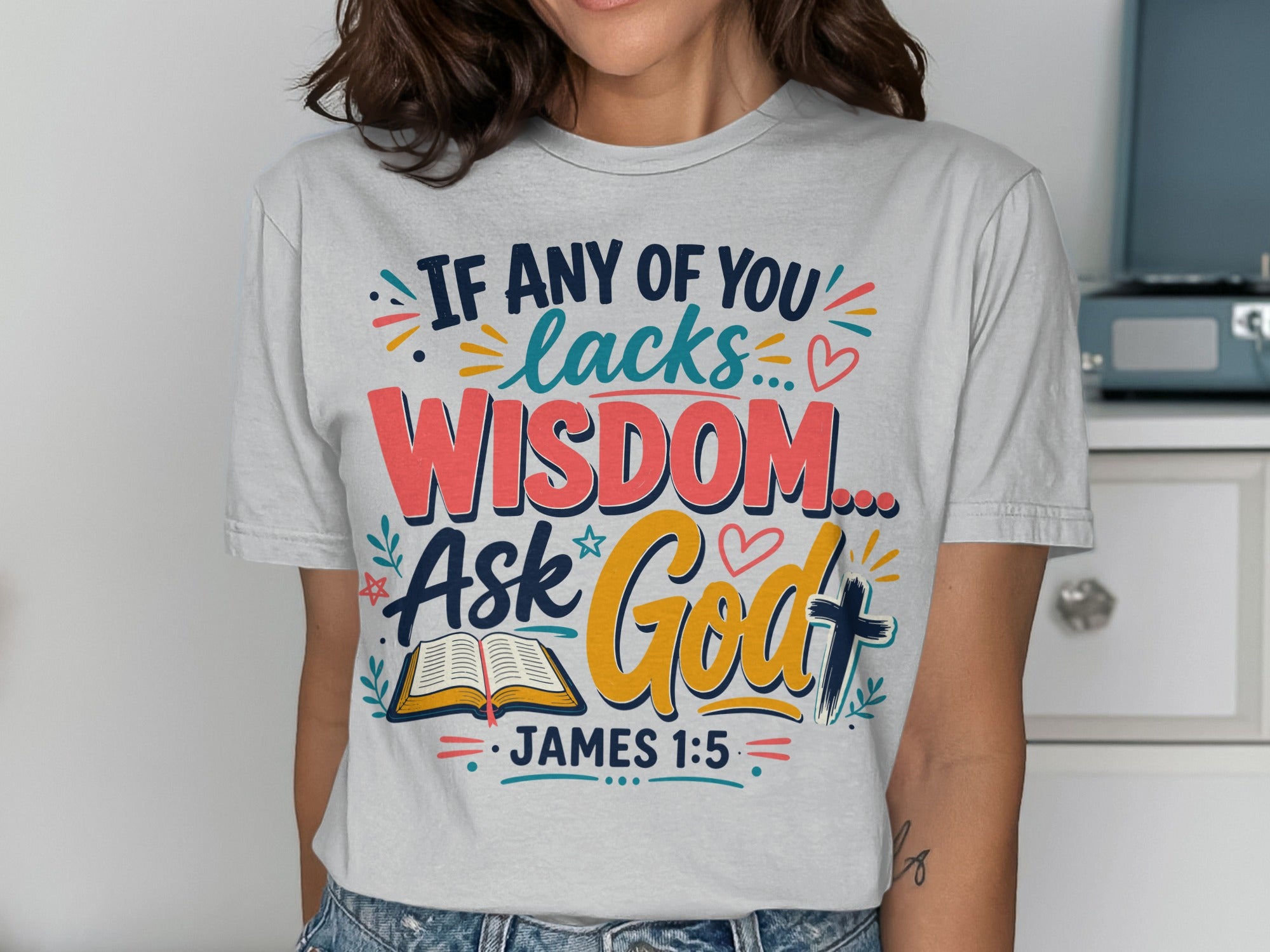 White t-shirt with "If any of you lacks wisdom, ask God James 1:5" text.