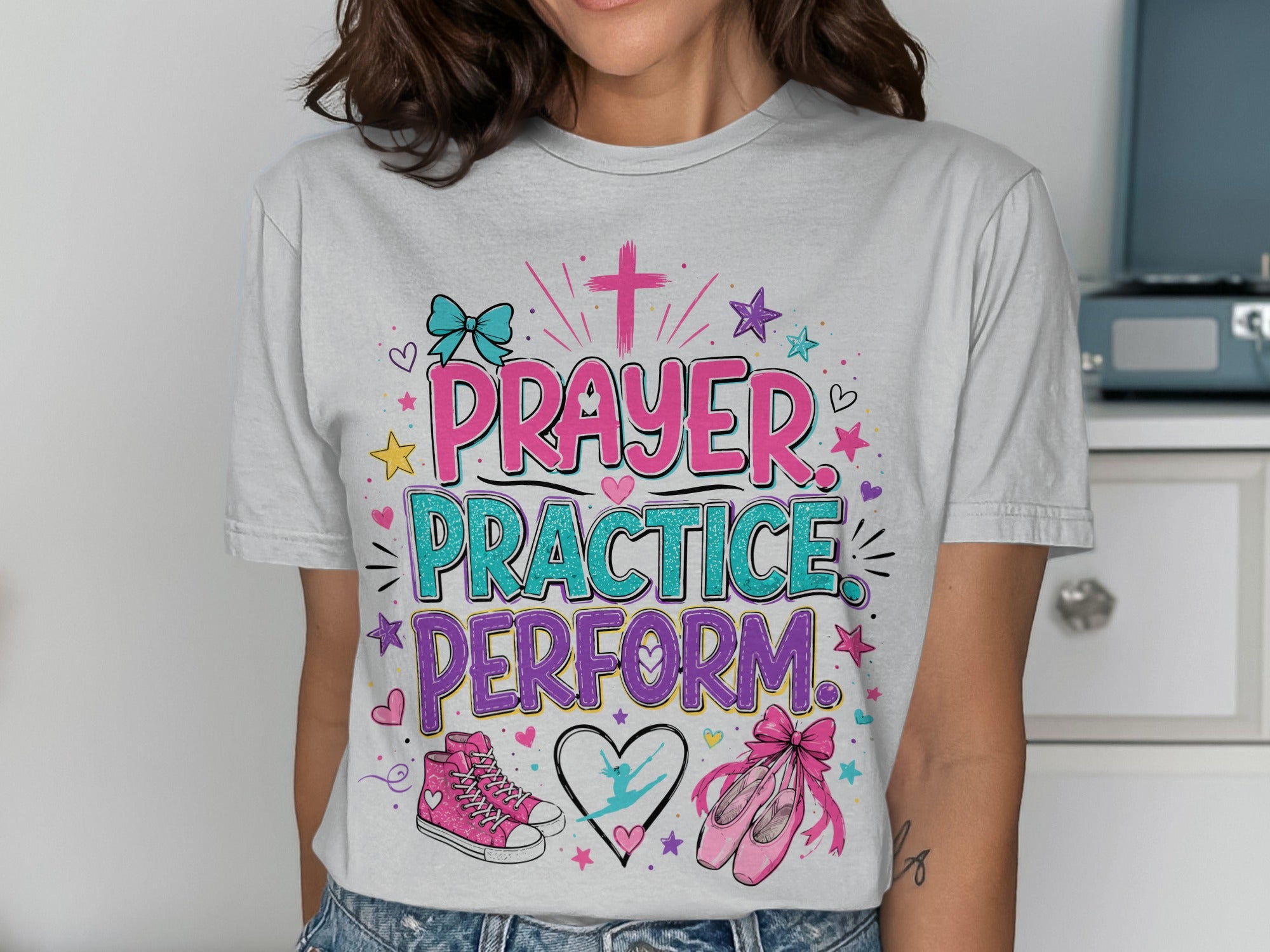 T-shirt with "Prayer Practice Perform" text and ballet shoe graphics.
