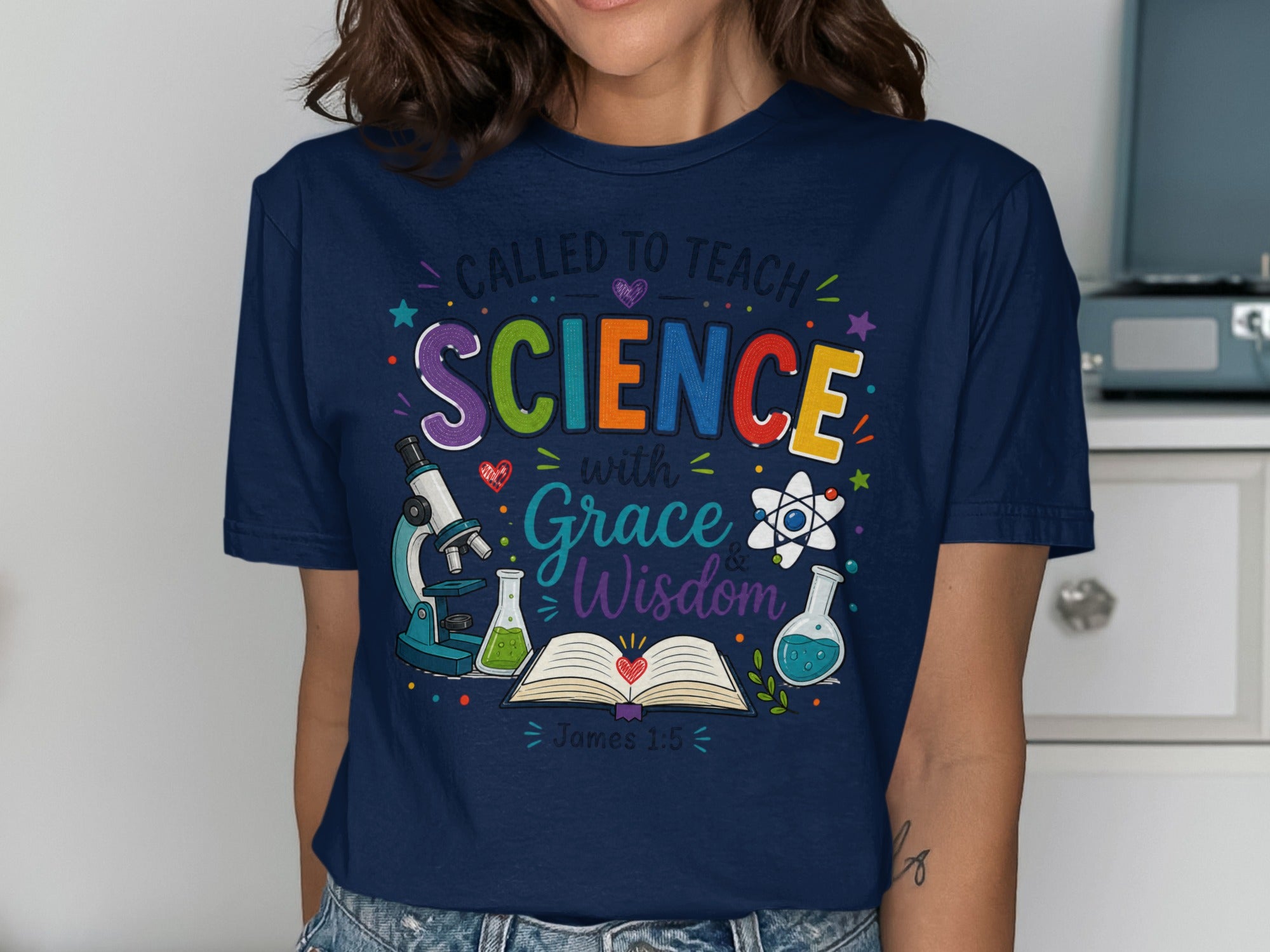 T-shirt with "Called to Teach Science with Grace and Wisdom" and science icons.