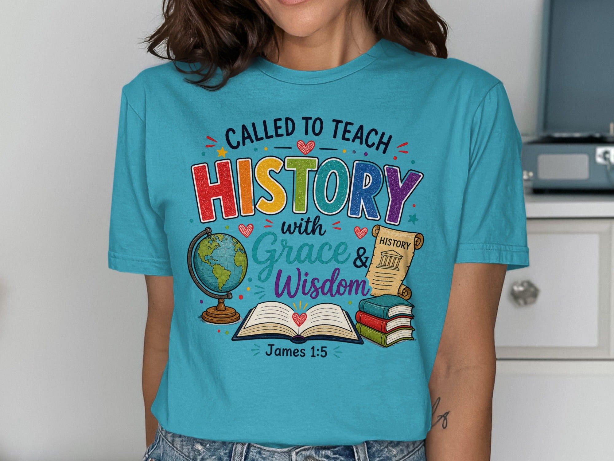 "Called to Teach History with Grace & Wisdom" text on a t-shirt with globe and scroll.