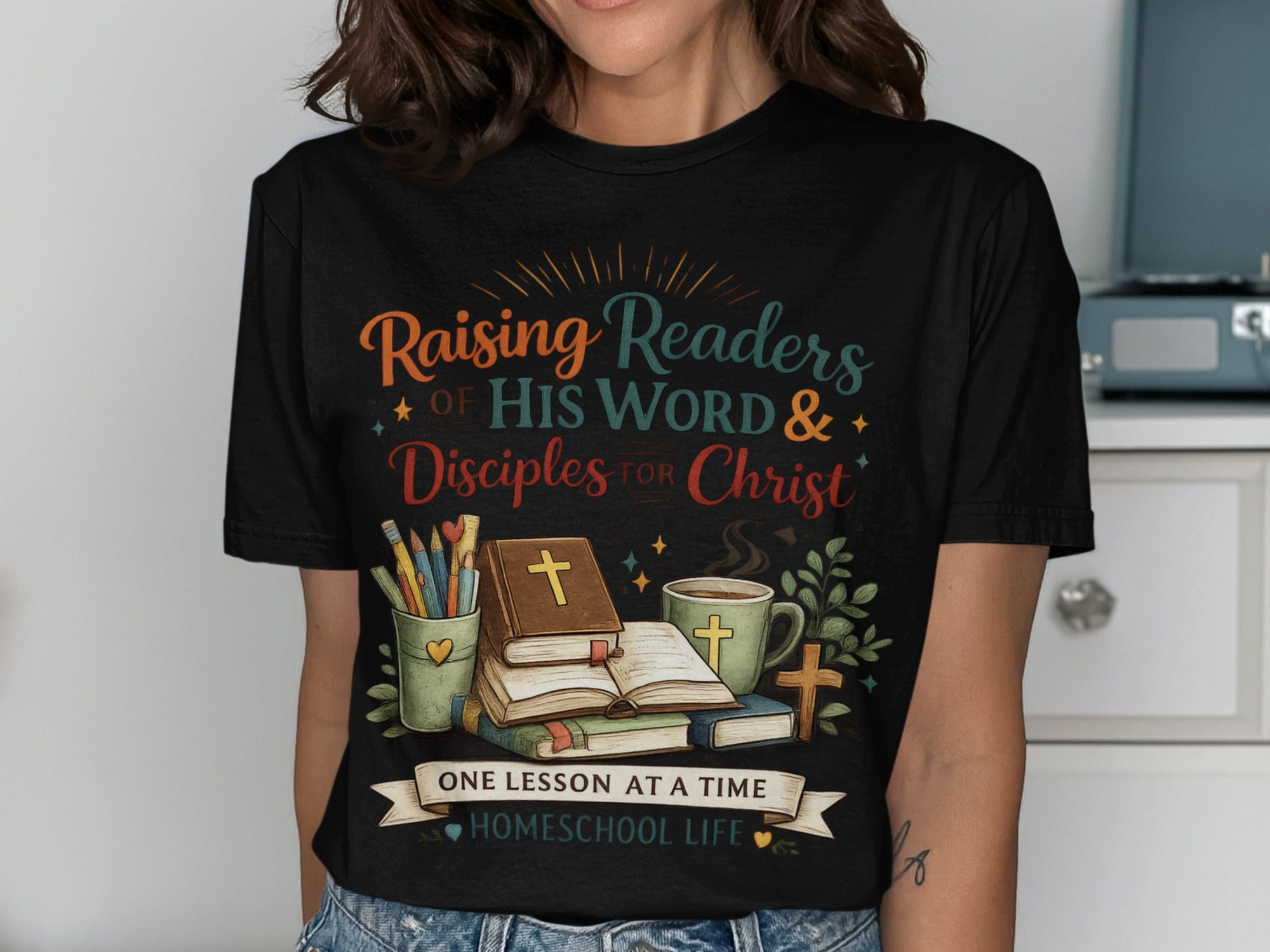 Black t-shirt with "Raising Readers of His Word & Disciples for Christ" and "Homeschool Life."