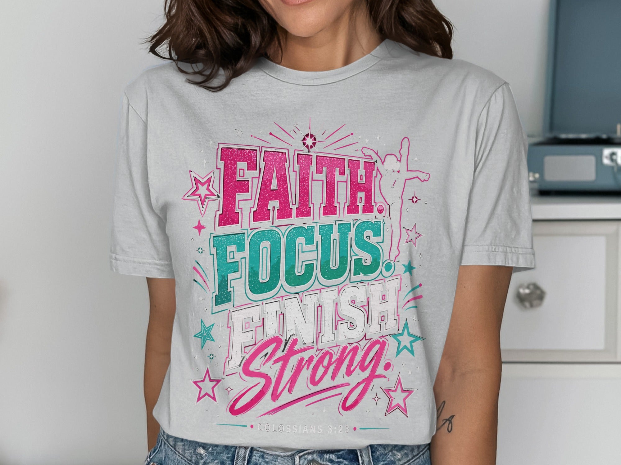 T-shirt with "FAITH FOCUS. FINISH STRONG." text and stars.