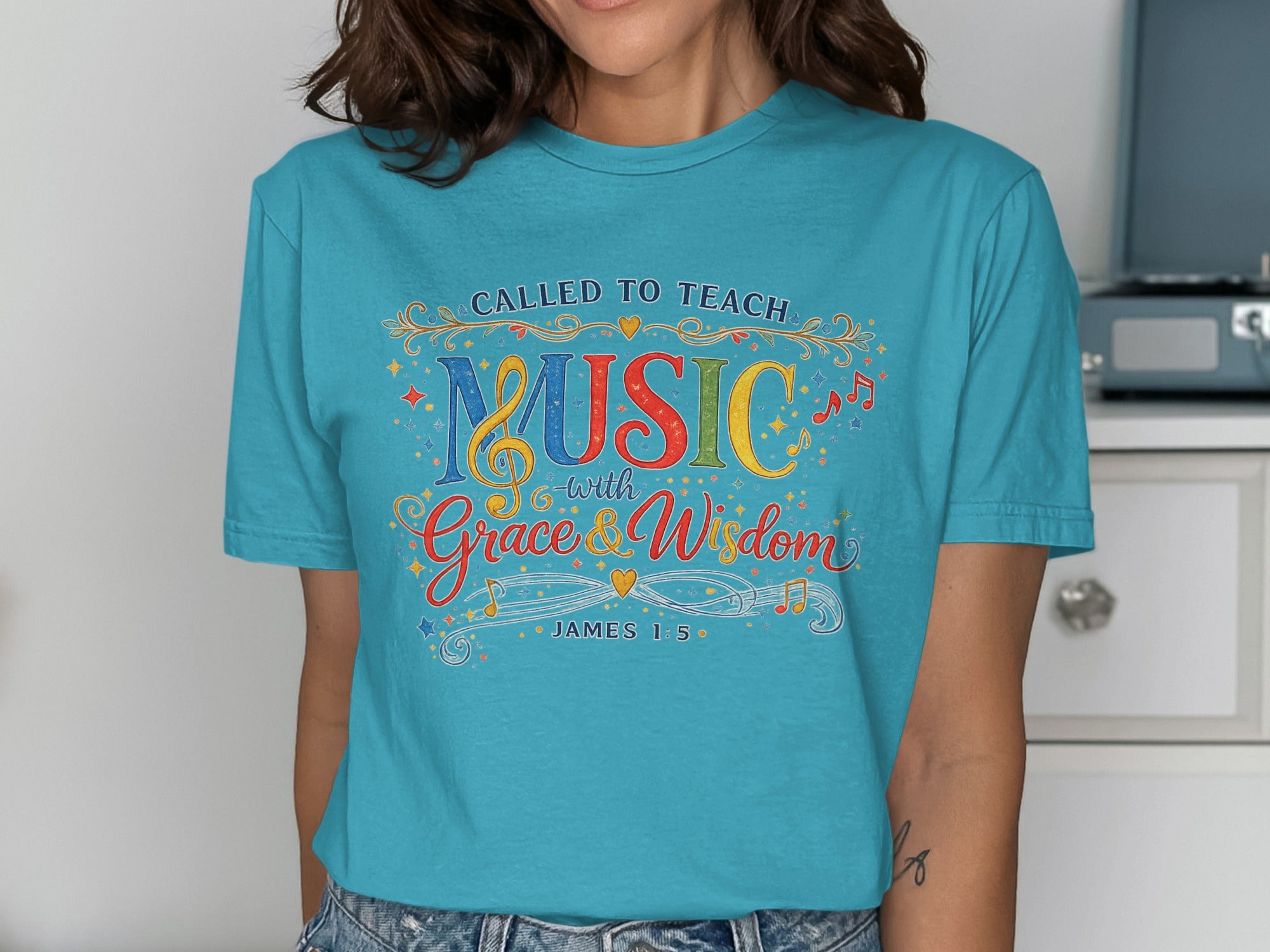 Teal t-shirt with "Called to Teach Music with Grace & Wisdom" and James 1:5.