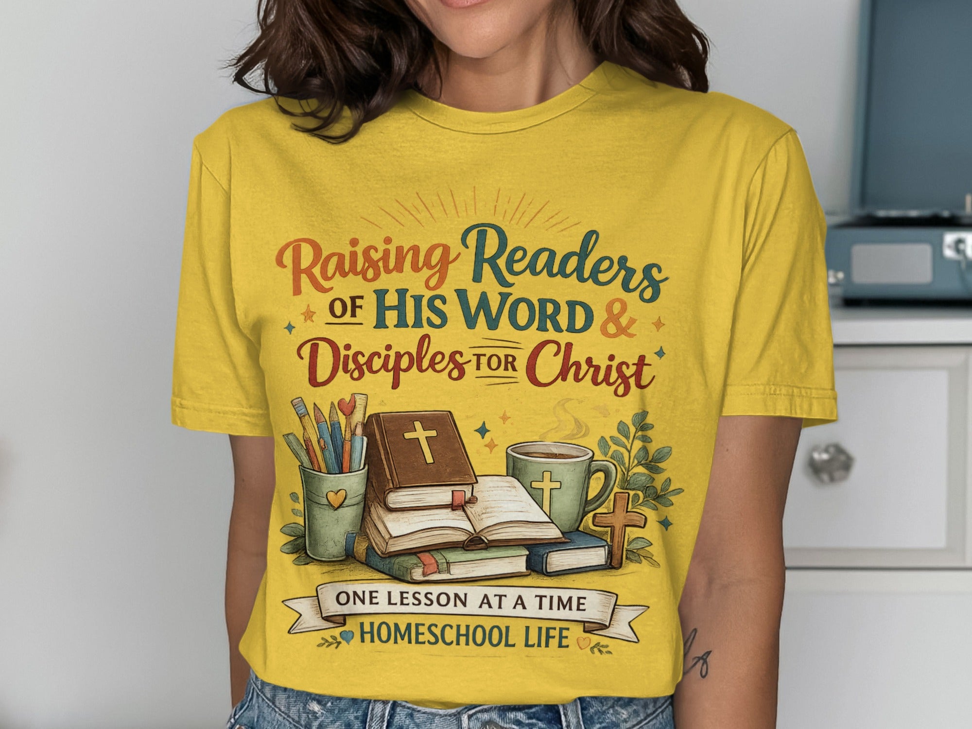 Yellow t-shirt with "Raising Readers of His Word & Disciples for Christ" and "Homeschool Life".