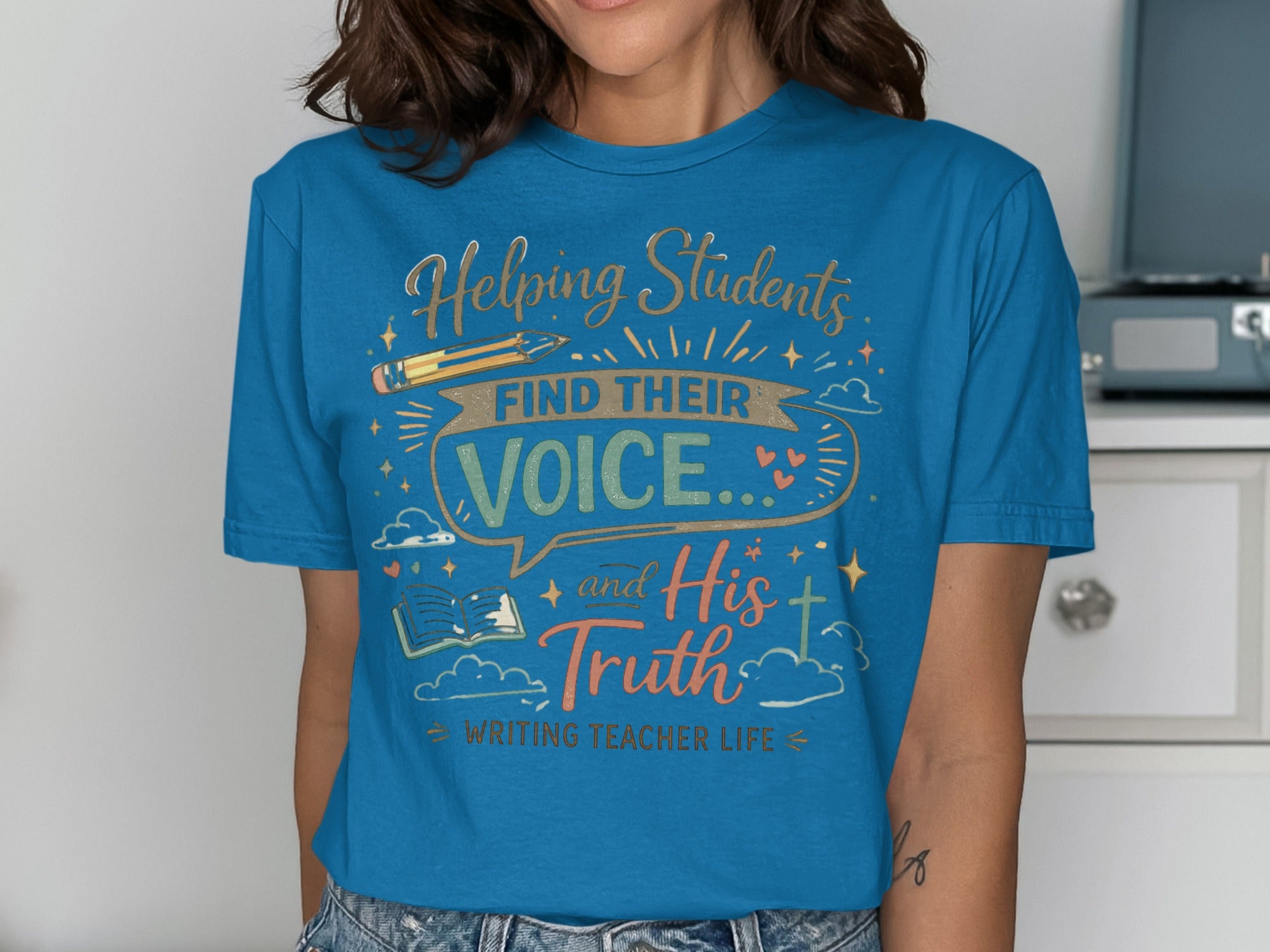 Blue t-shirt with text: Helping Students Find Their Voice and His Truth Writing Teacher Life.