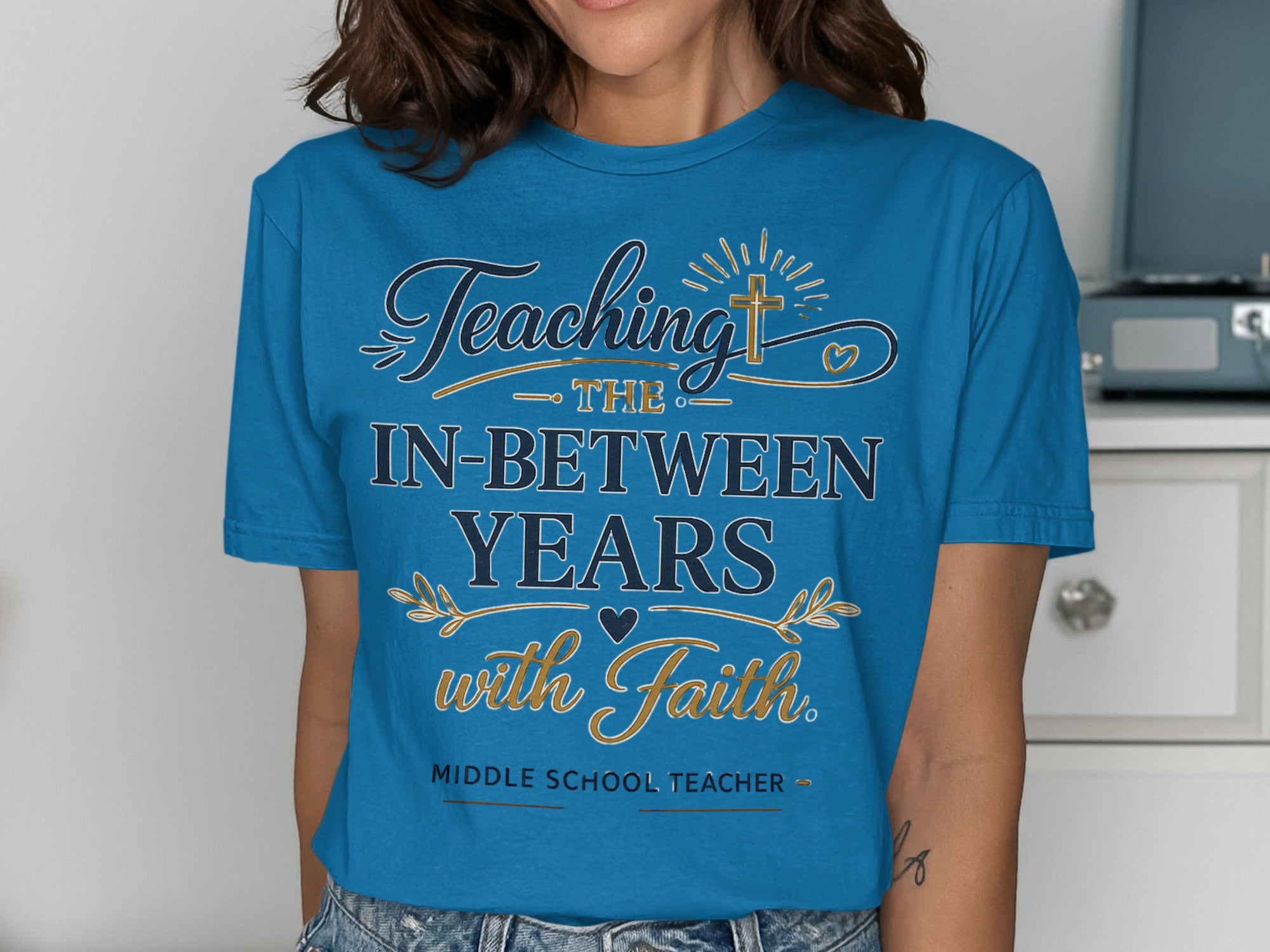 Teal t-shirt with "Teaching the In-Between Years with Faith" text.