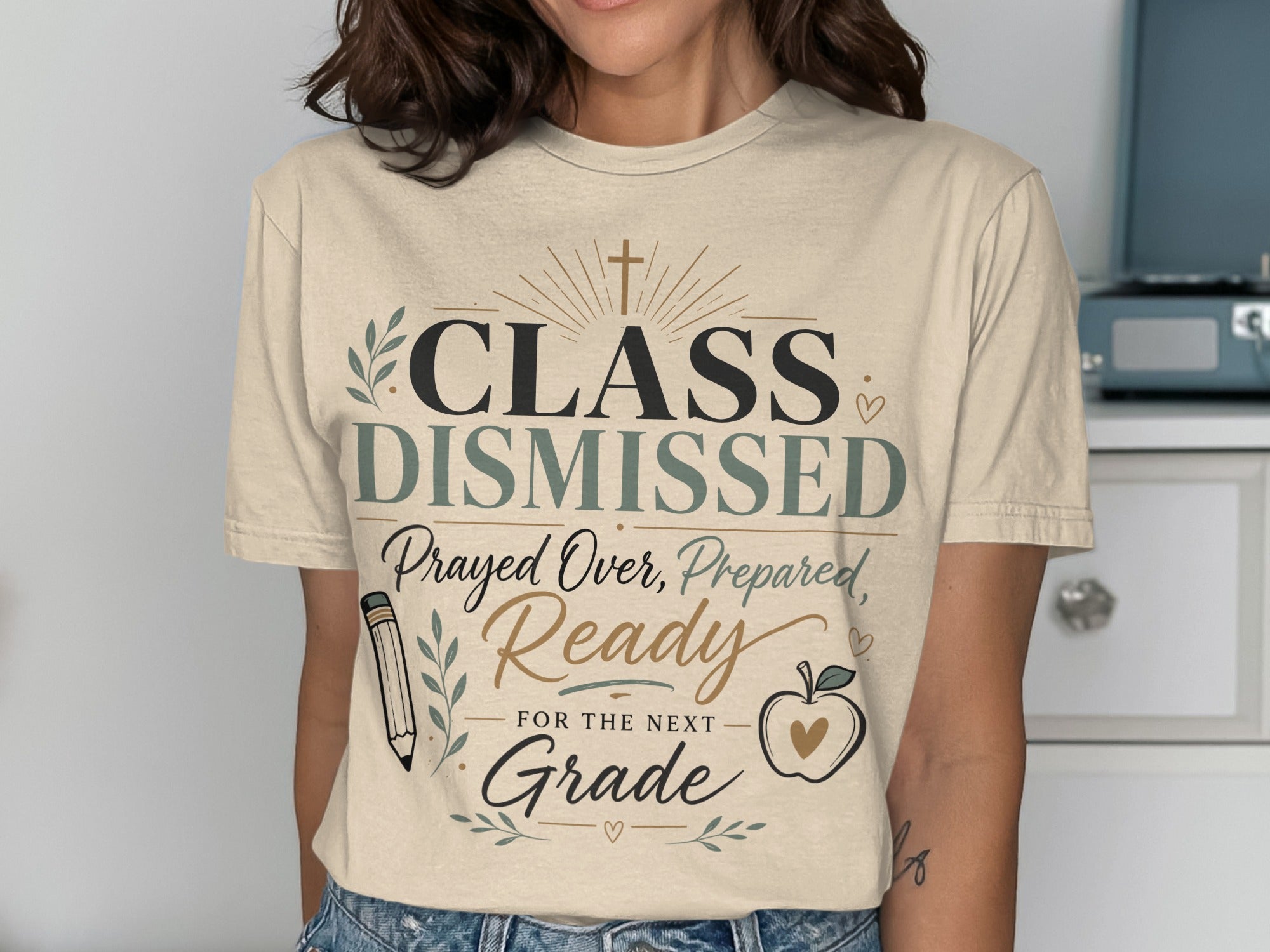 T-shirt with "Class Dismissed" design, featuring school-themed graphics and text.
