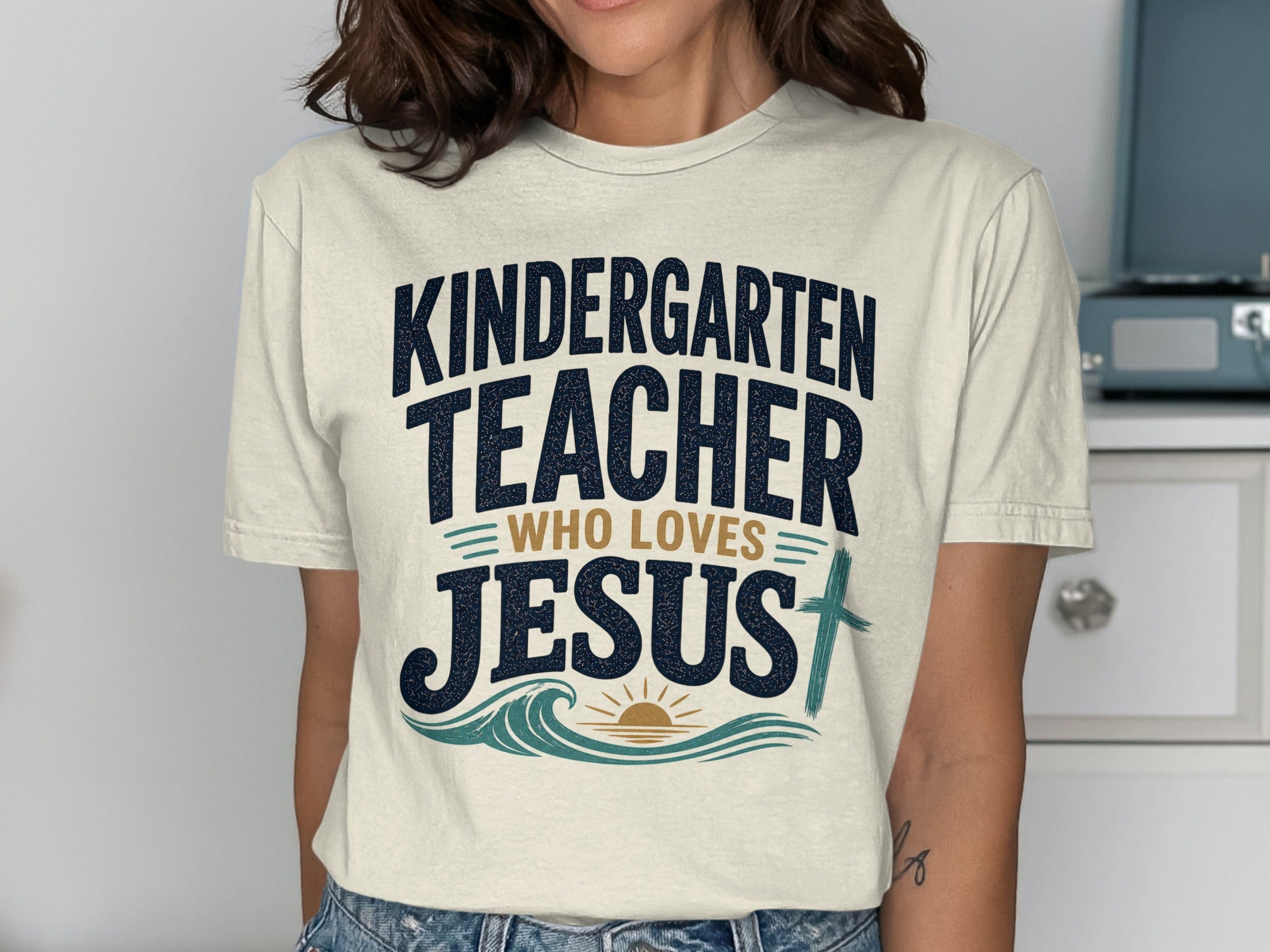 KINDERGARTEN TEACHER WHO LOVES JESUS graphic t-shirt.