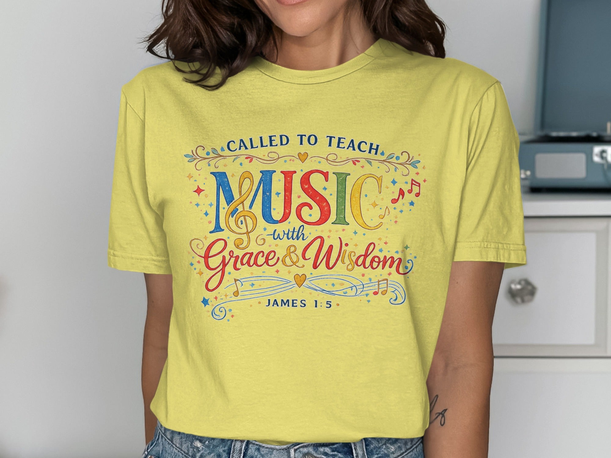 Yellow t-shirt with "Called to Teach Music with Grace & Wisdom" and "James 1:5" text.