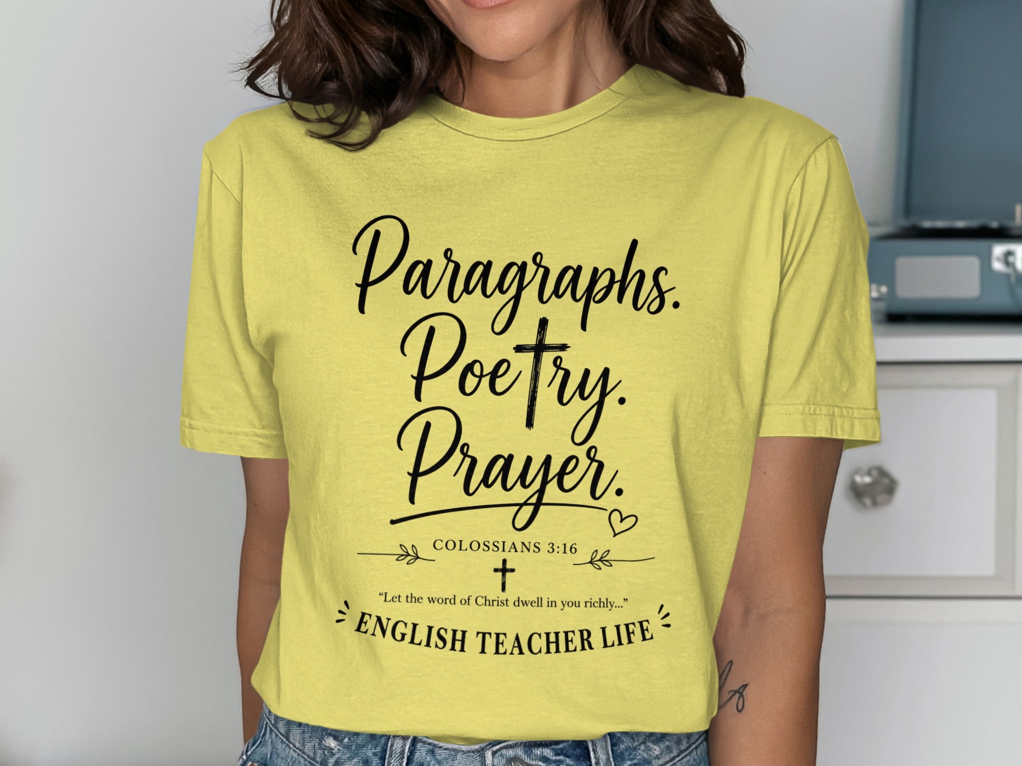 Yellow t-shirt with "Paragraphs. Poetry. Prayer." and Bible verse.