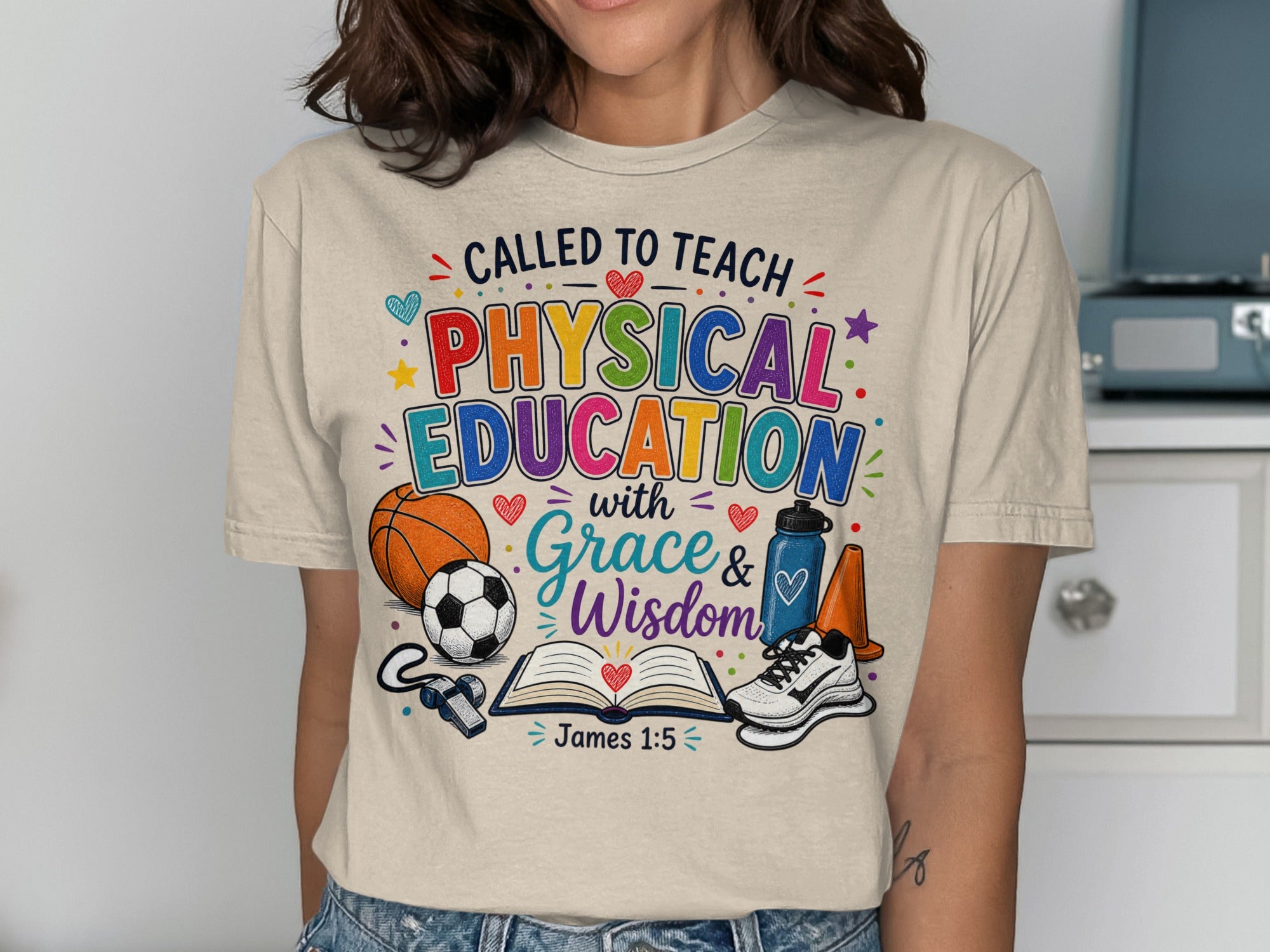 T-shirt with "Called to Teach Physical Education with Grace & Wisdom" and sports icons.