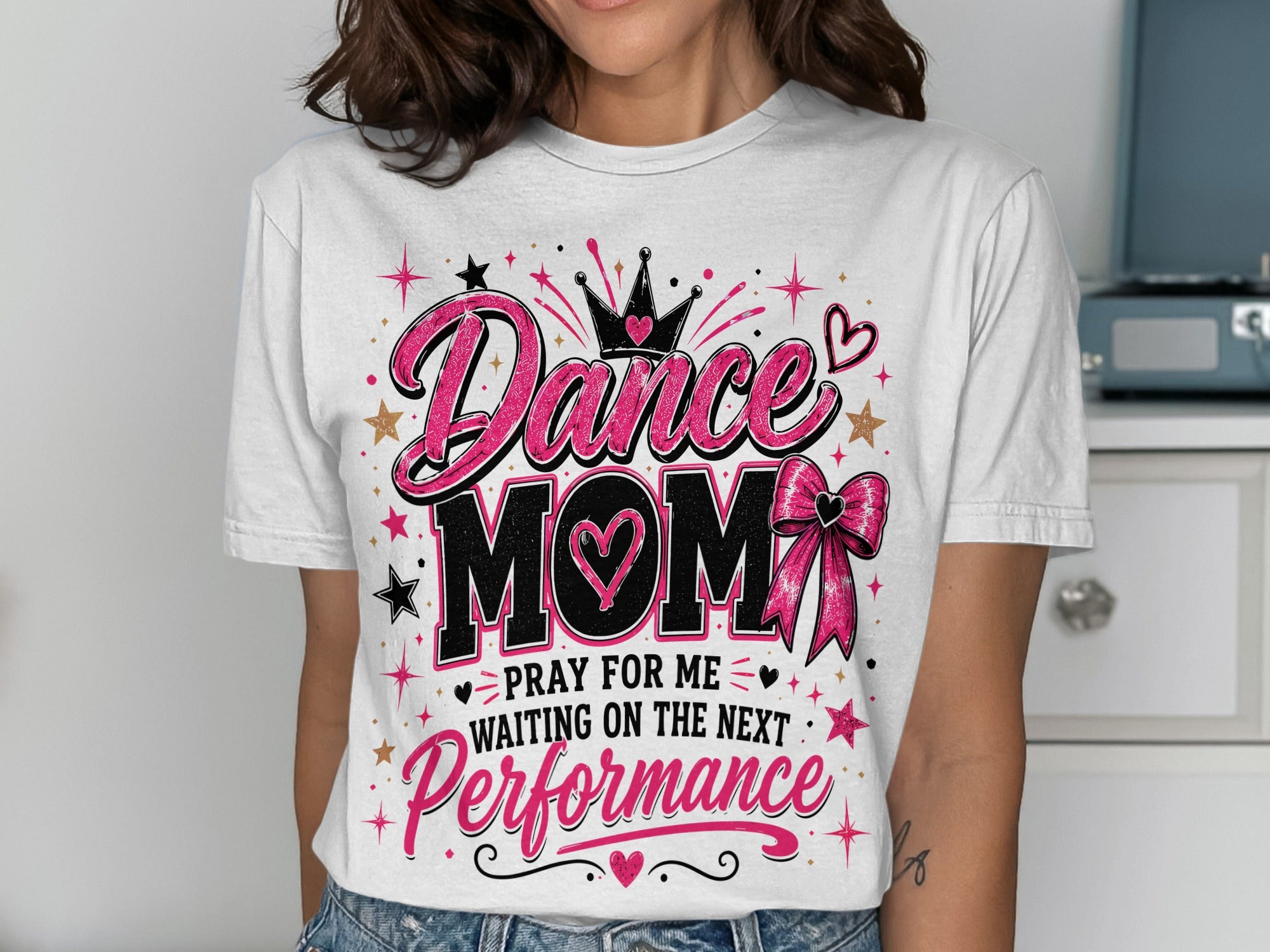 White t-shirt with "Dance Mom" and crown design, stars, and bow.