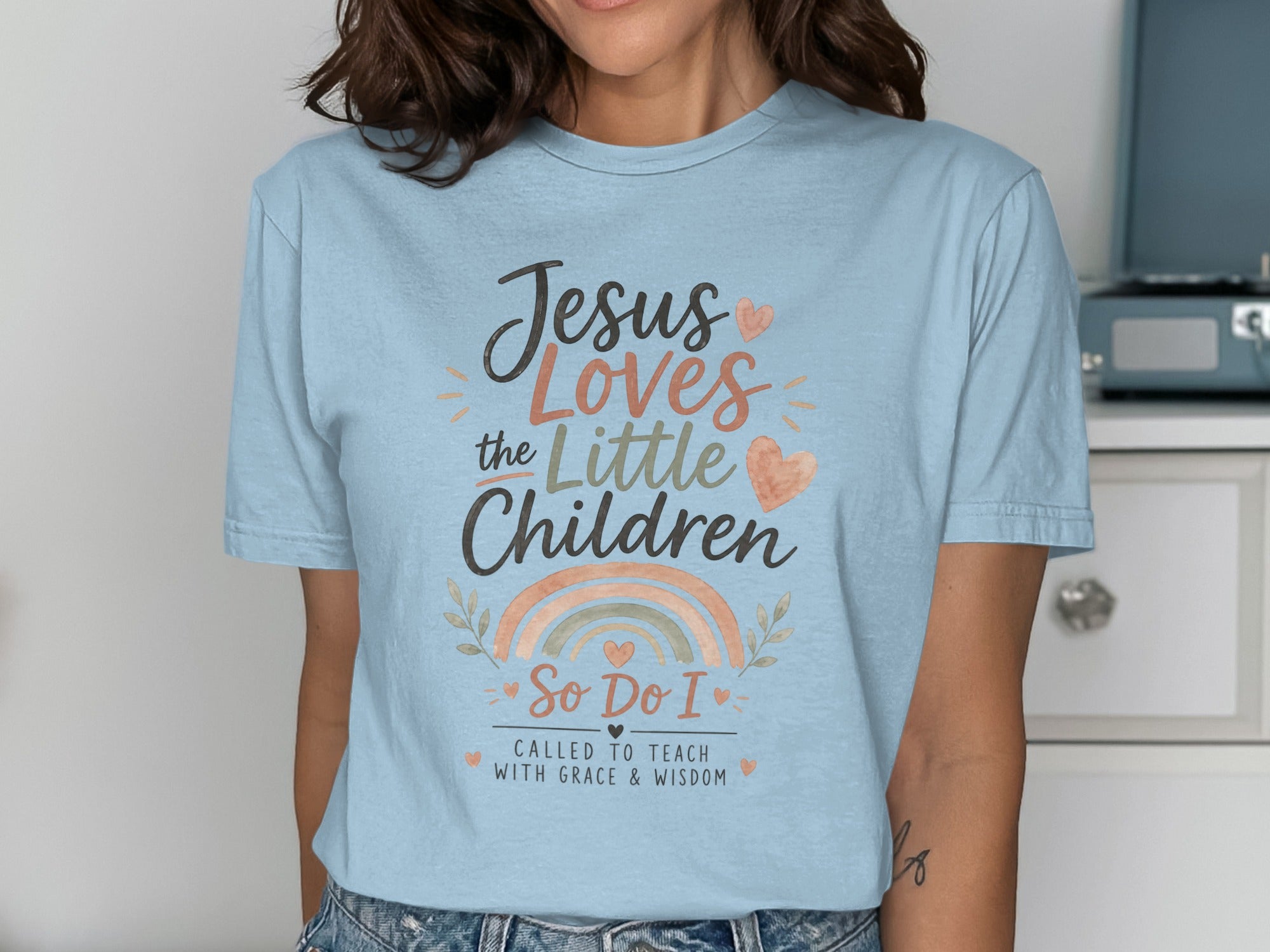 Light blue t-shirt with "Jesus Loves the Little Children, So Do I" text.