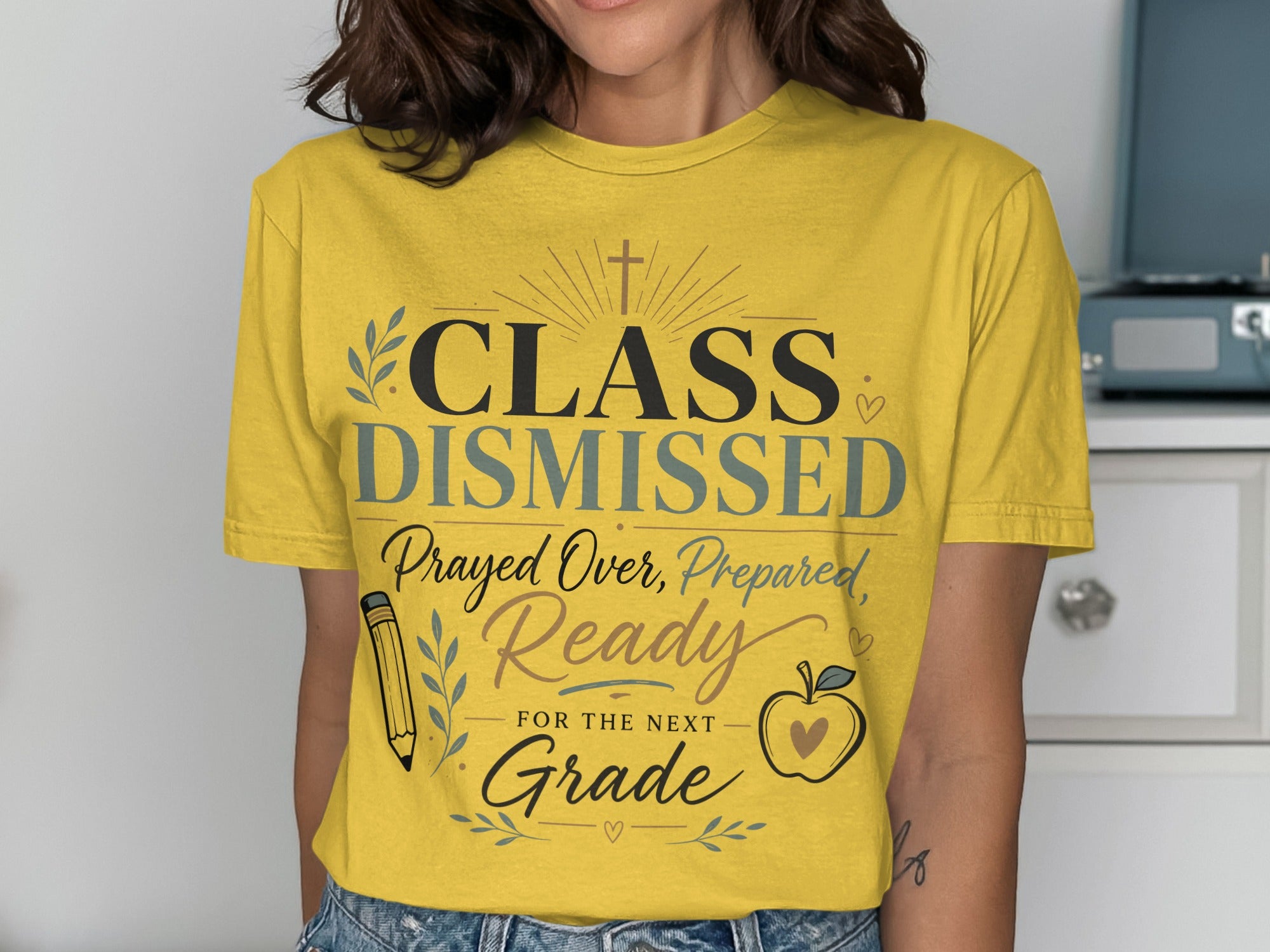 Yellow t-shirt with "CLASS DISMISSED" and school-themed graphics.