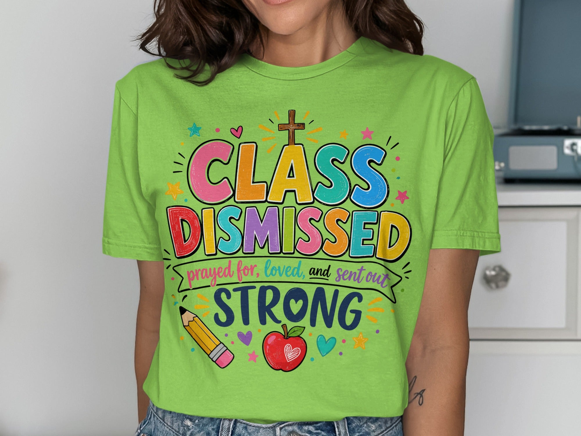 Green t-shirt with "CLASS DISMISSED" in colorful letters, "prayed for, loved, and sent out STRONG".