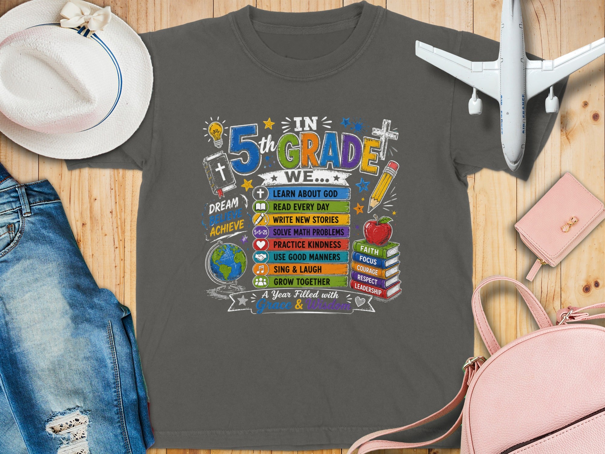T-shirt with "In 5th Grade We..." theme and school-related icons.