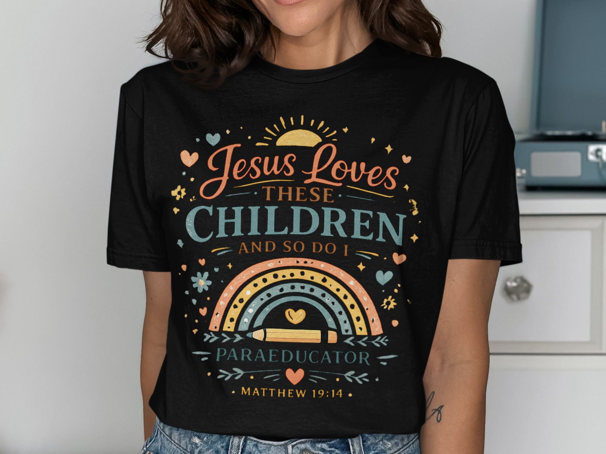 Black t-shirt with "Jesus Loves These Children And So Do I" and "Paraeducator" text.