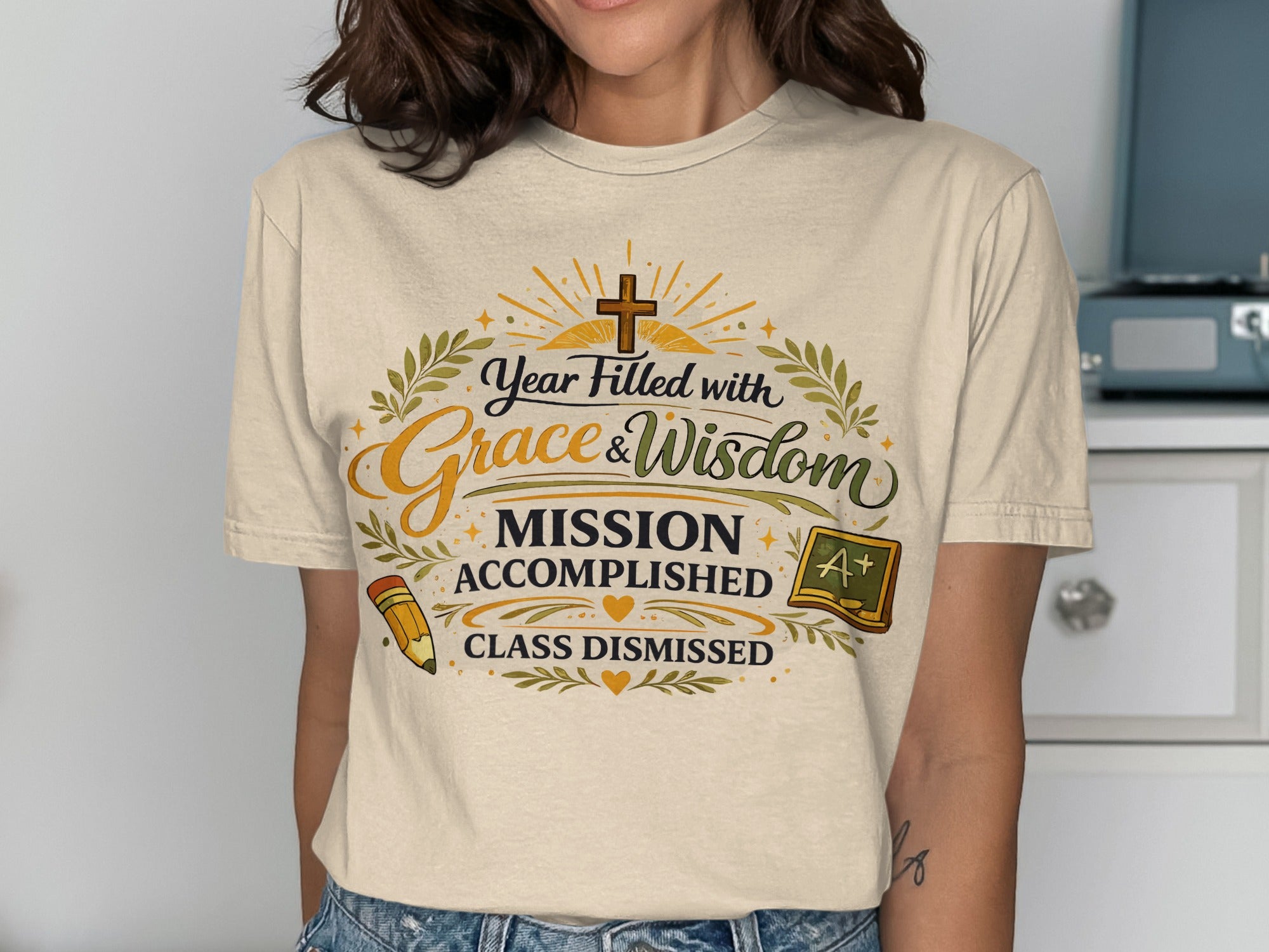 Cream t-shirt with "Year Filled With Grace & Wisdom Mission Accomplished Class Dismissed" text.