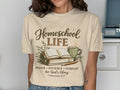 T-shirt design with "Homeschool Life" text, open book, coffee, and a bible verse.