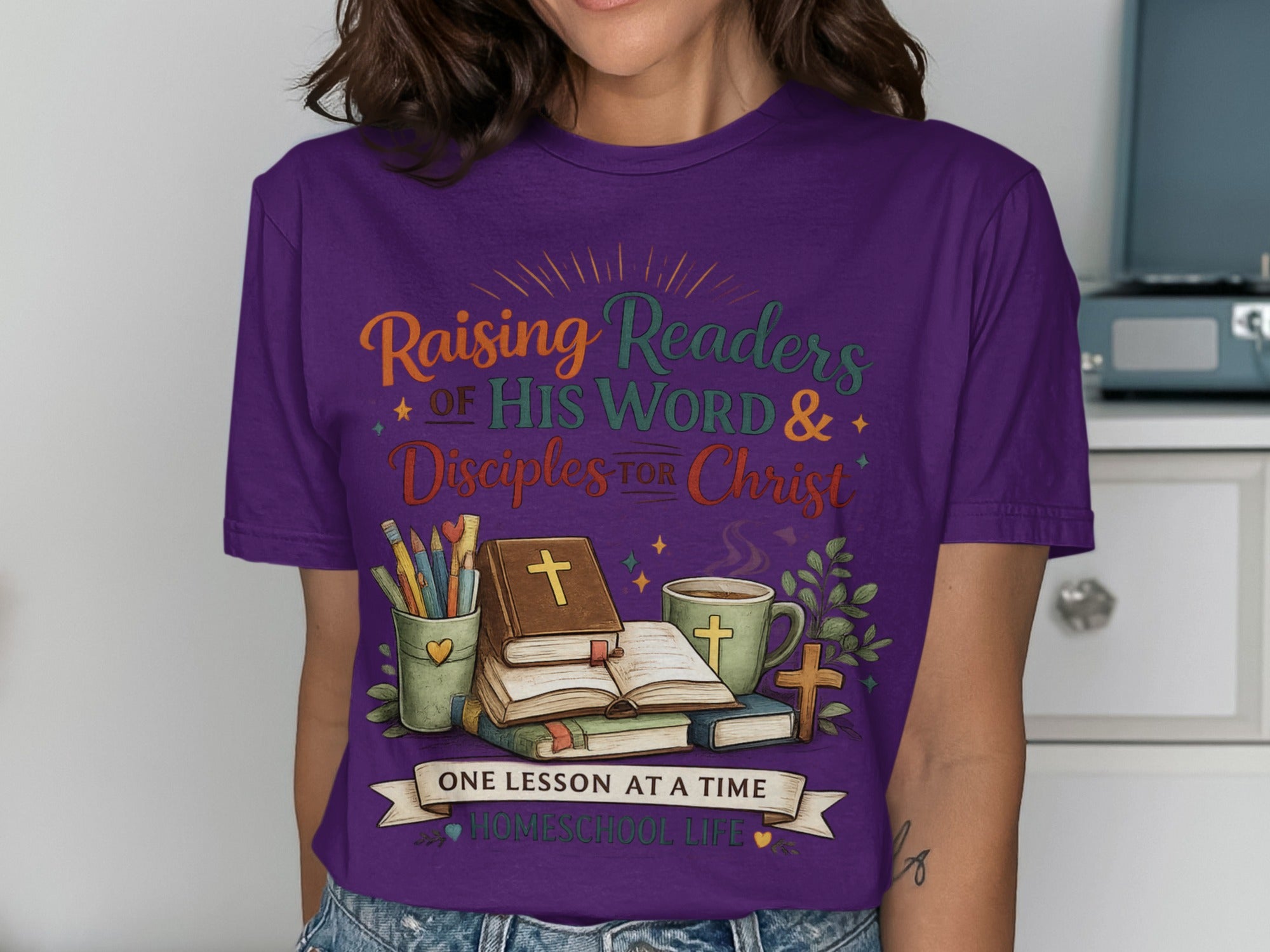 Purple t-shirt with "Raising Readers of His Word & Disciples for Christ" and "Homeschool Life."
