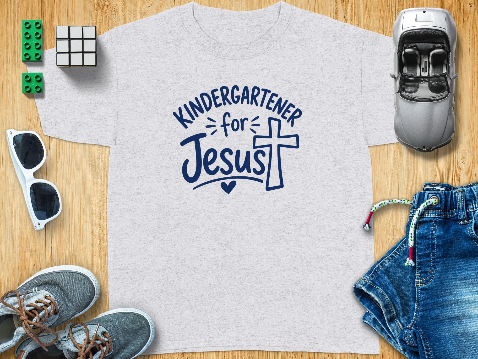Gray t-shirt with "Kindergartener for Jesus" text and a cross.