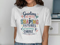 White t-shirt with colorful text: "Guiding Hearts, Shaping Futures, Serving Christ. Middle School Teacher."