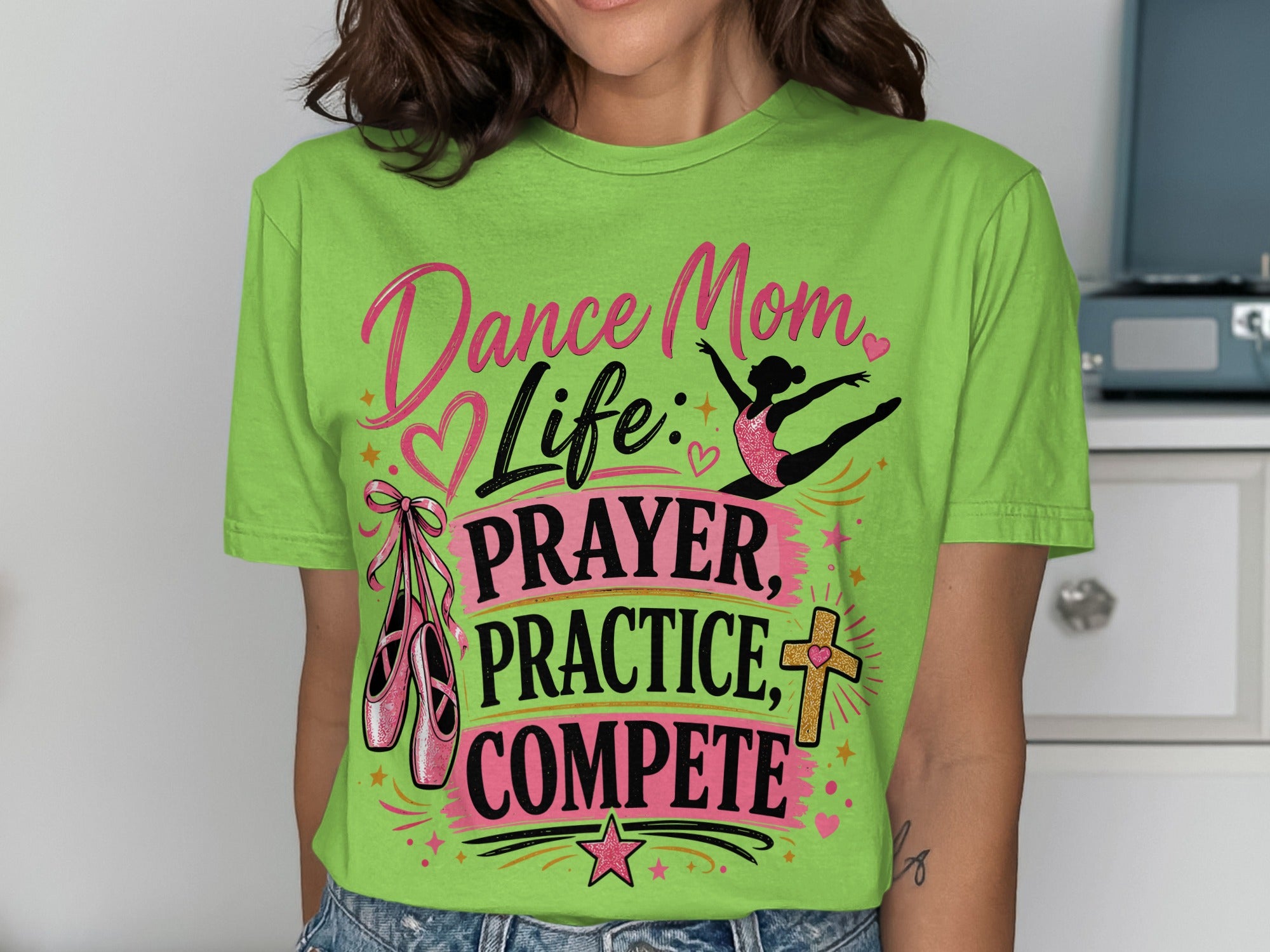 Green t-shirt with "Dance Mom Life: Prayer, Practice, Compete" text and ballet shoes.