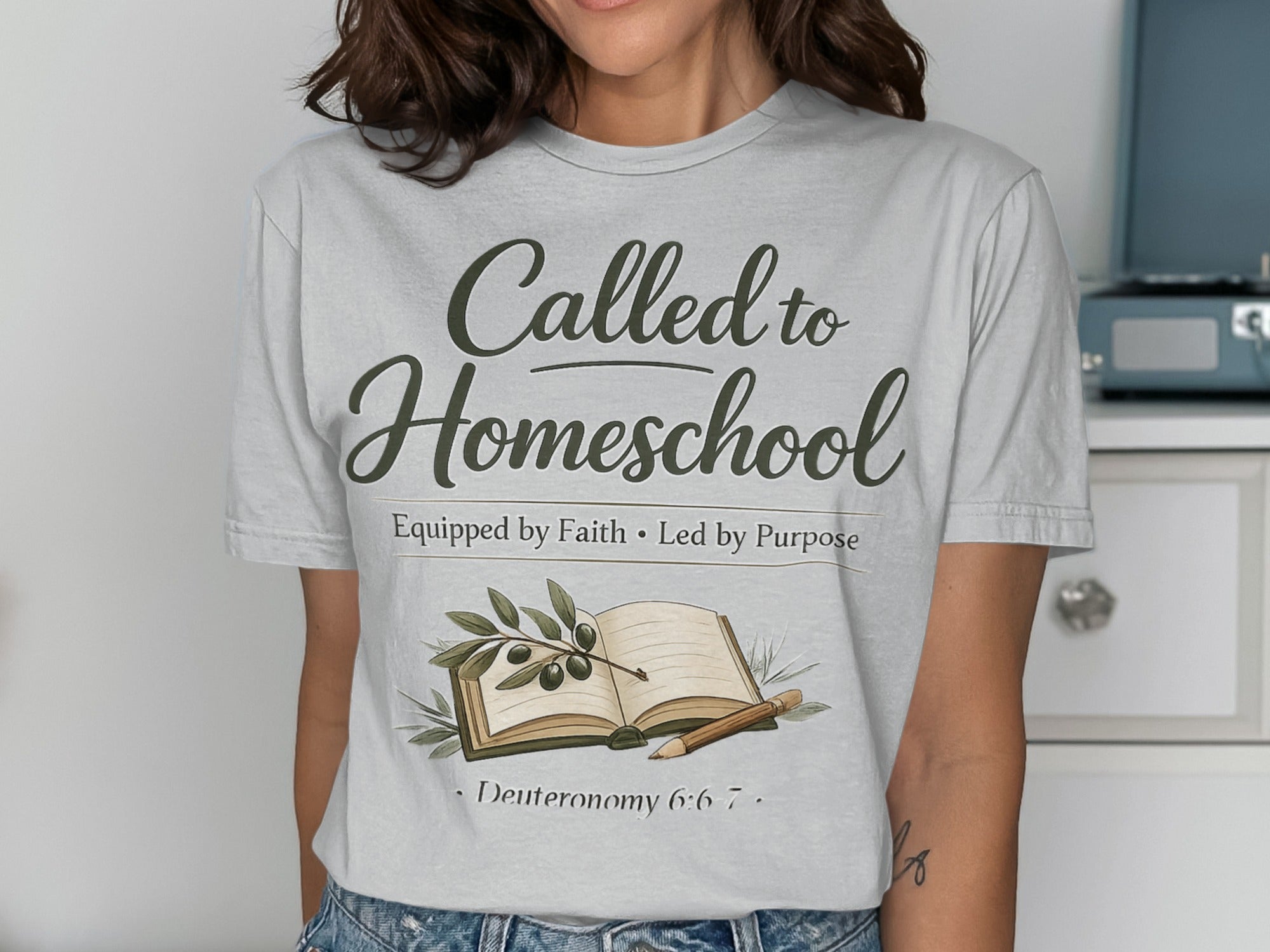 T-shirt with "Called to Homeschool" text, olive branch, and book.