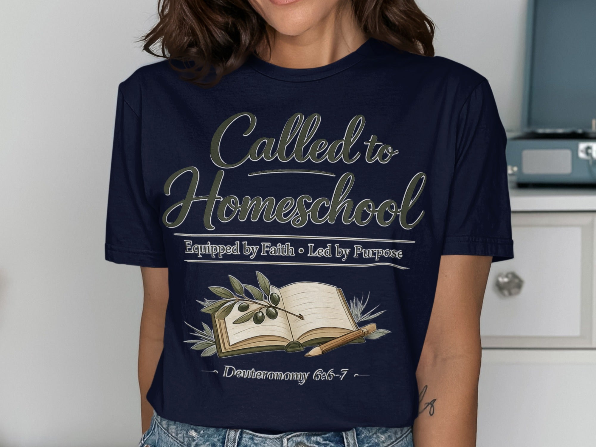 Dark blue t-shirt with "Called to Homeschool" text, book, and olive branch.